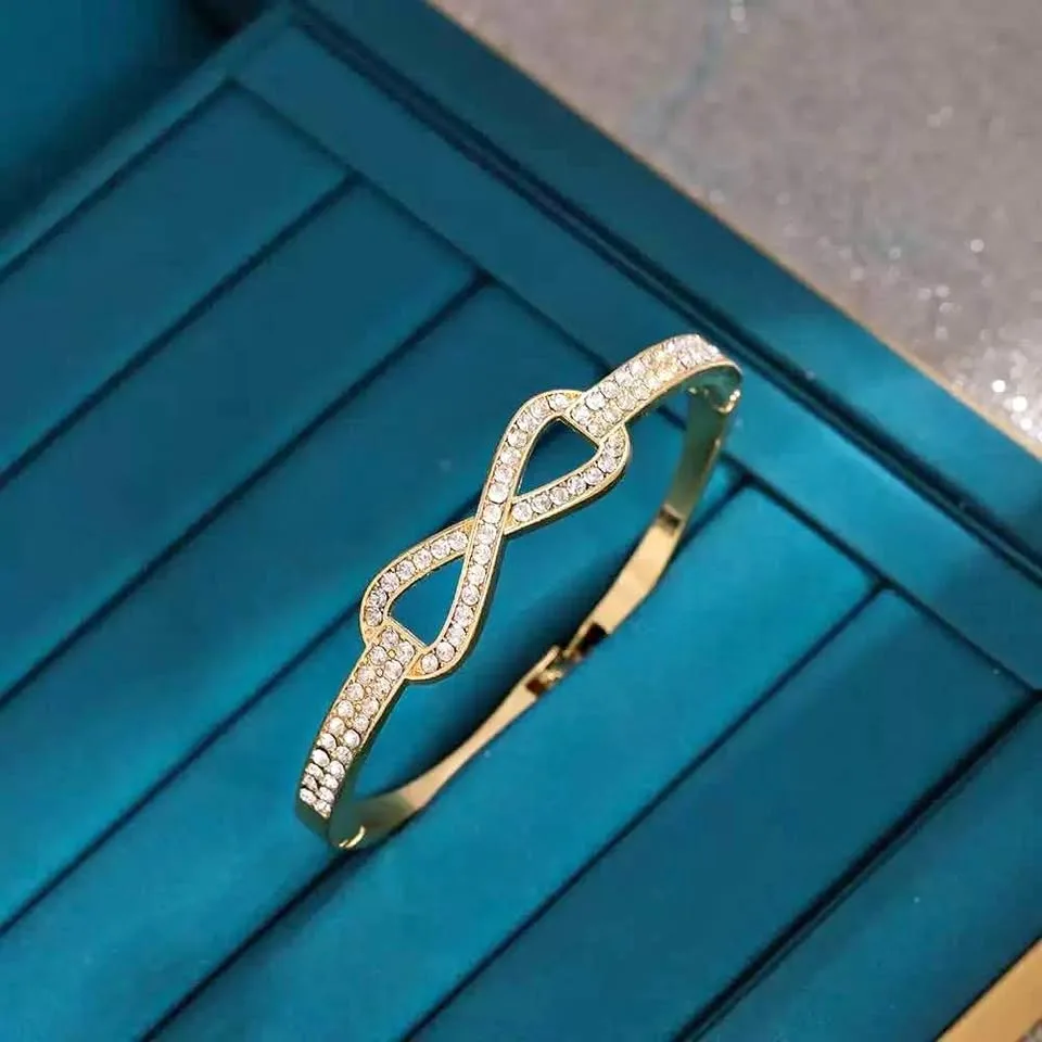 Gold plated Infinity bangle thumbnail