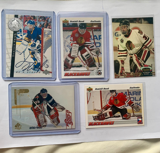 24 Dominik Hasek NHL Cards. 1 Autograph, 1 Rookie Card