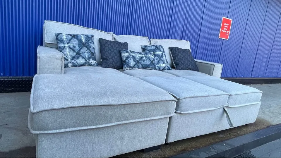 (FREE DELIVERY) Gray Bobs Furniture pullout bed sectional couch image indicator(4)