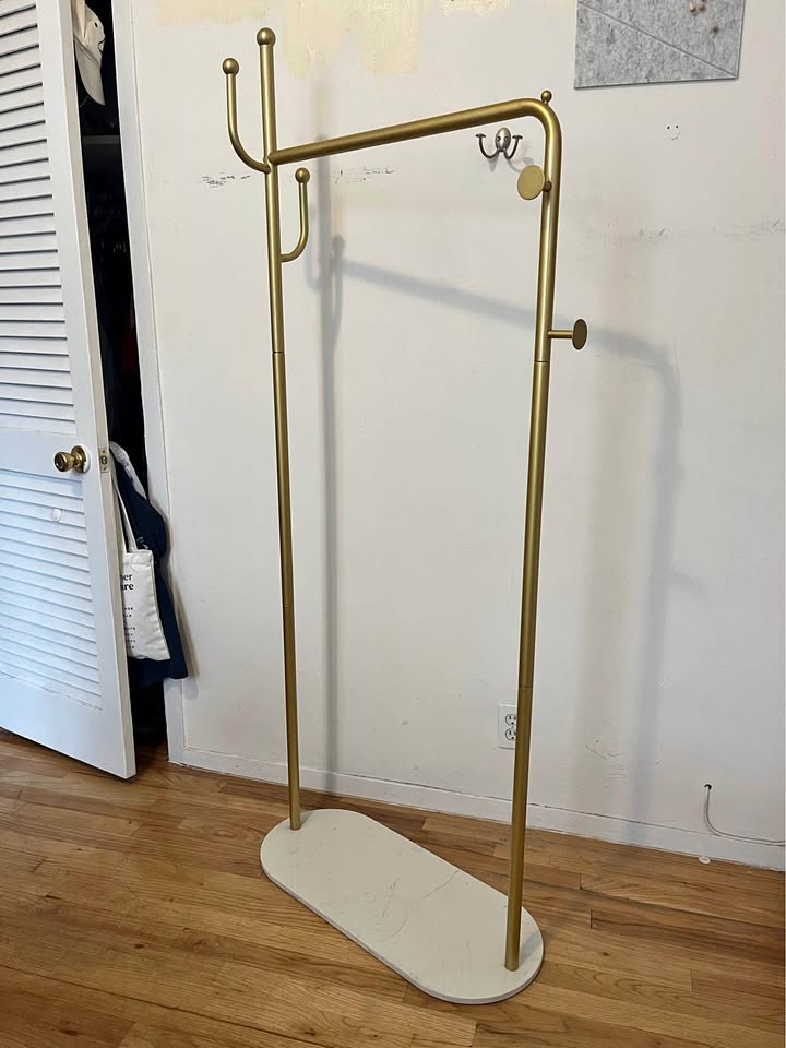 Gold and white coat rack
