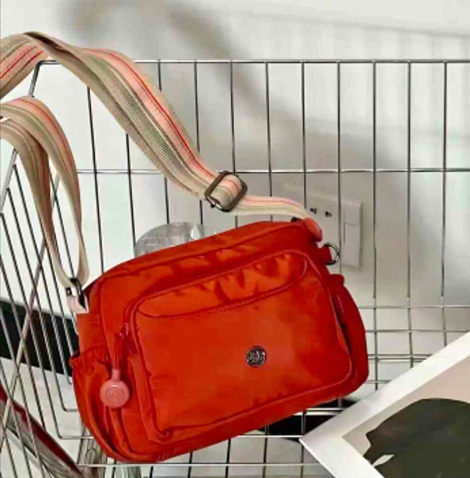Brand new light weight nylon crossbody bag with multiple zips
