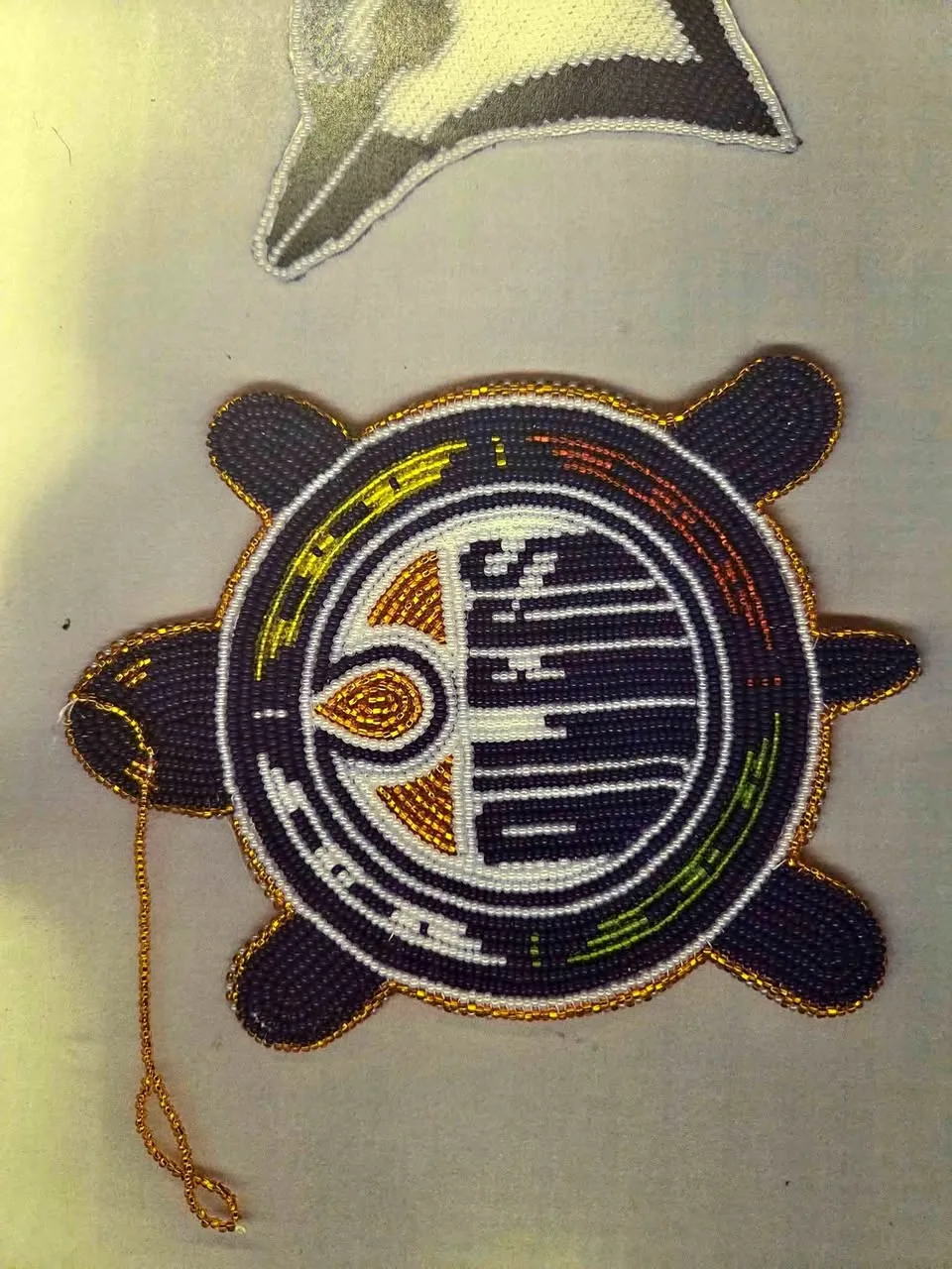 Handmade beaded oilers medallions and etc