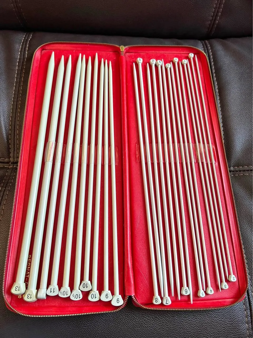 Set of vintage Bernat Aero knitting needles in a red case thumbnail
