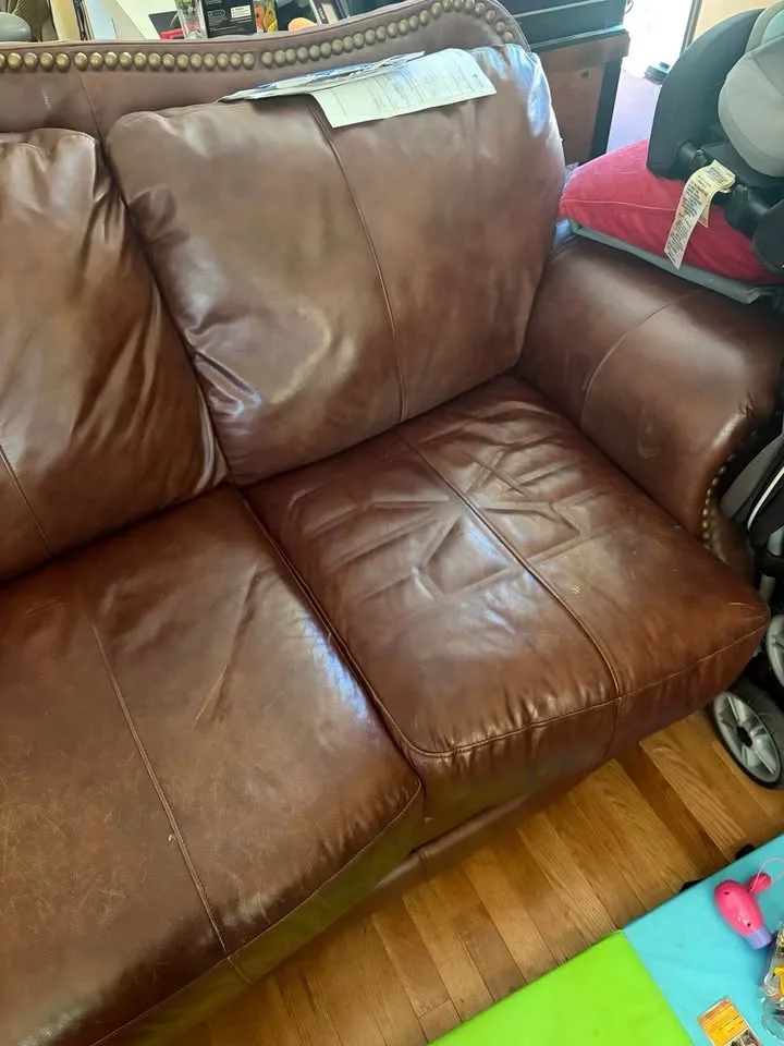 Brown leather couch image indicator(3)