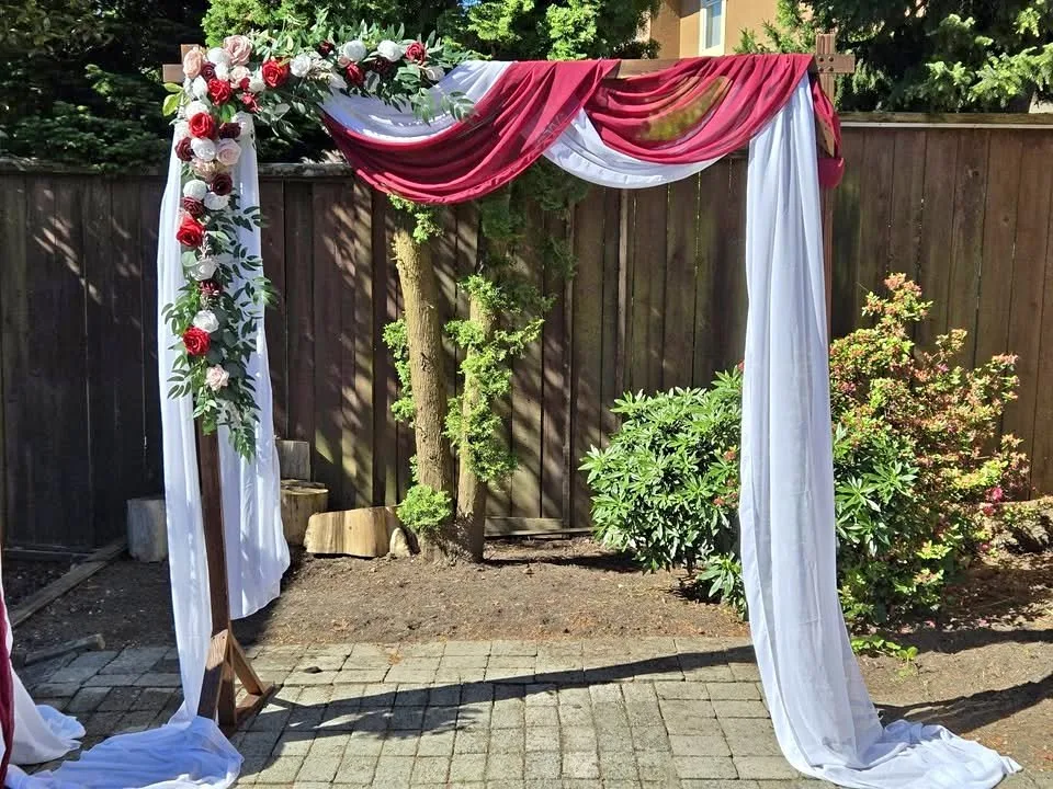 Wedding arch with drapes and floral thumbnail