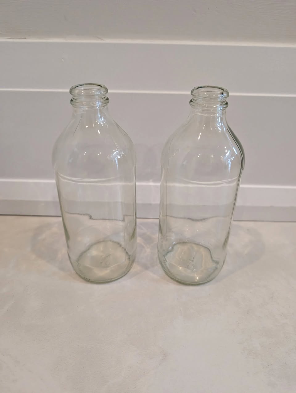 Two smaller clear glass vases