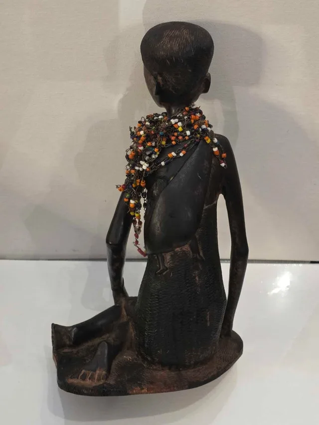 African mother carrying child 10 inch image indicator(2)