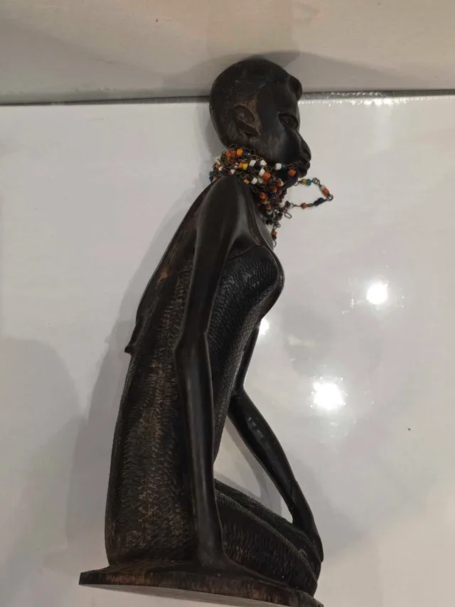 African mother carrying child 10 inch image indicator(4)