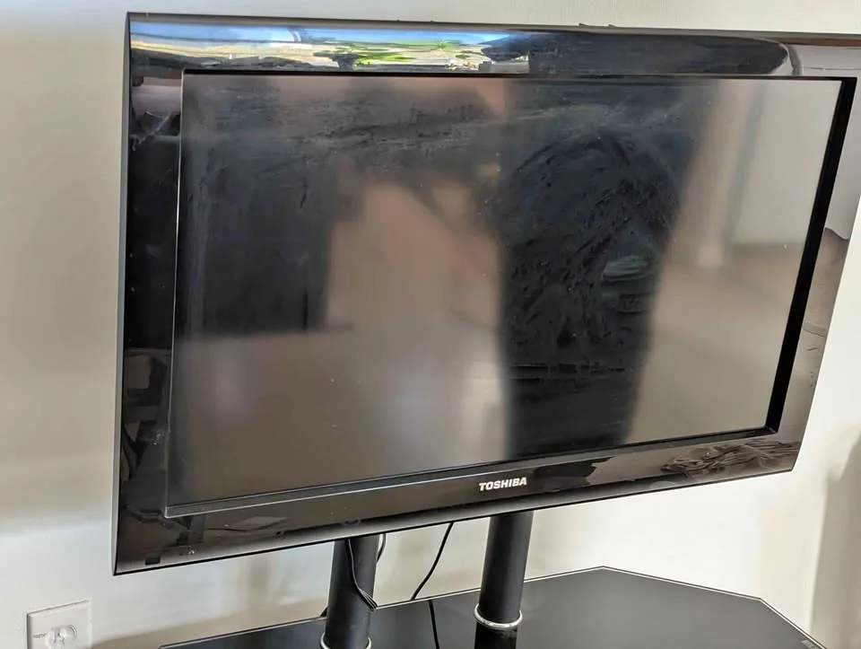 32-in flat TV with stand and DVD player and remotes