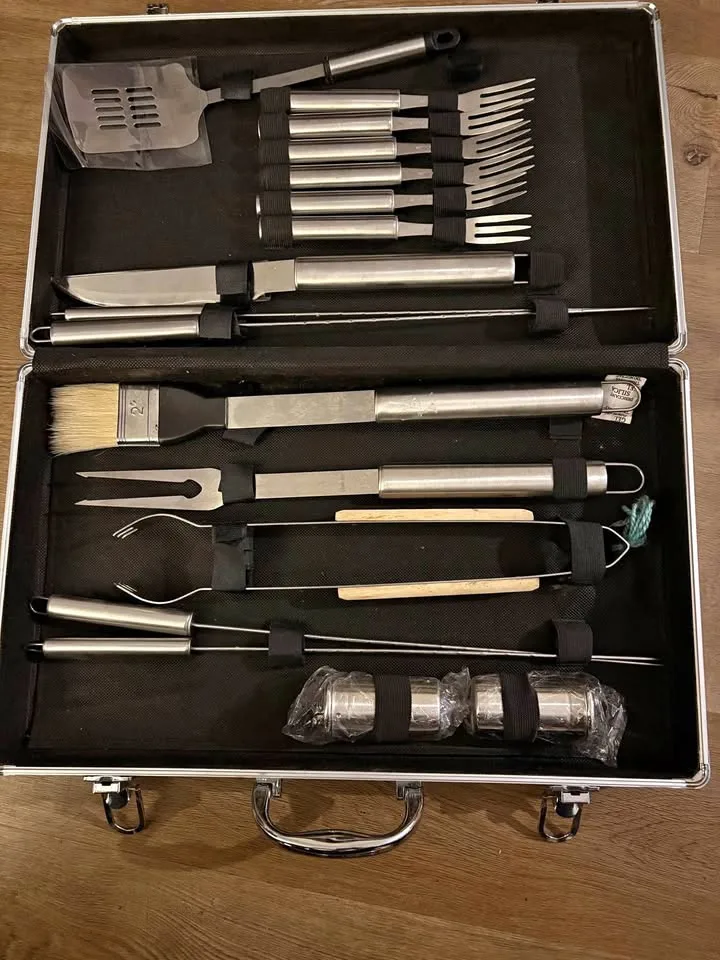 stainless steel BBQ tool set in a carrying case.