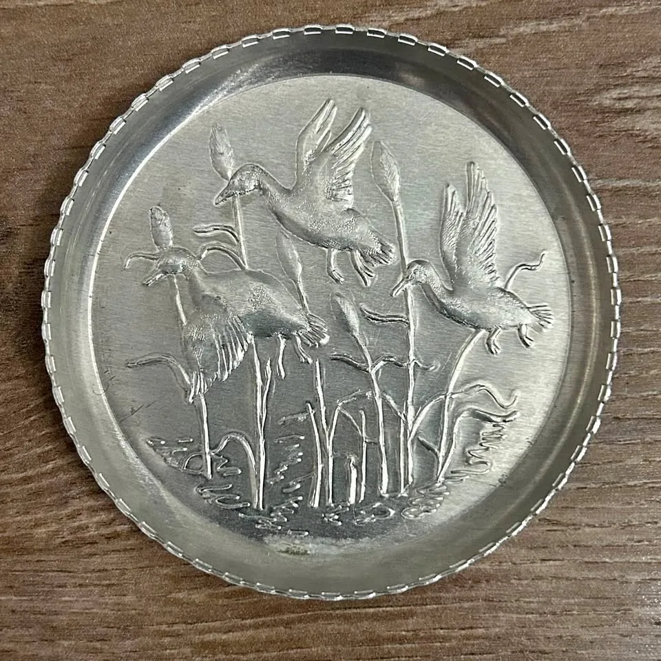 Set of 7 Vintage Embossed Metal Coasters