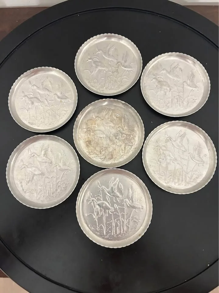 Set of 7 Vintage Embossed Metal Coasters image indicator(2)