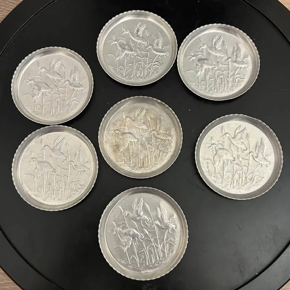 Set of 7 Vintage Embossed Metal Coasters image indicator(3)