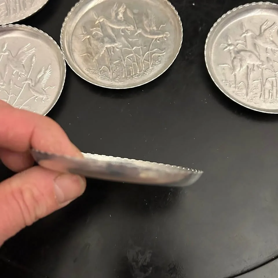 Set of 7 Vintage Embossed Metal Coasters image indicator(8)