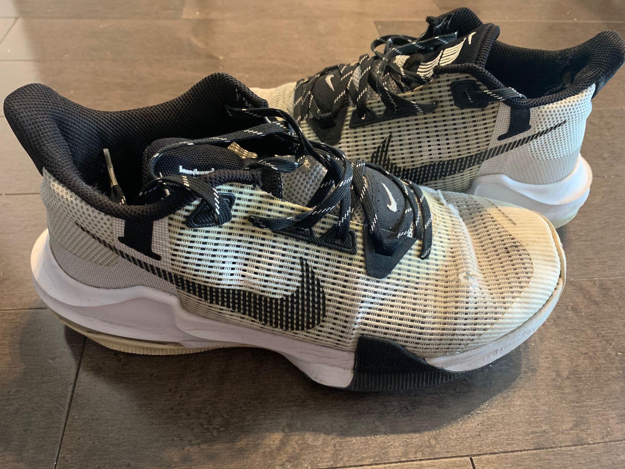 Nike sneakers with ***signs of wear***