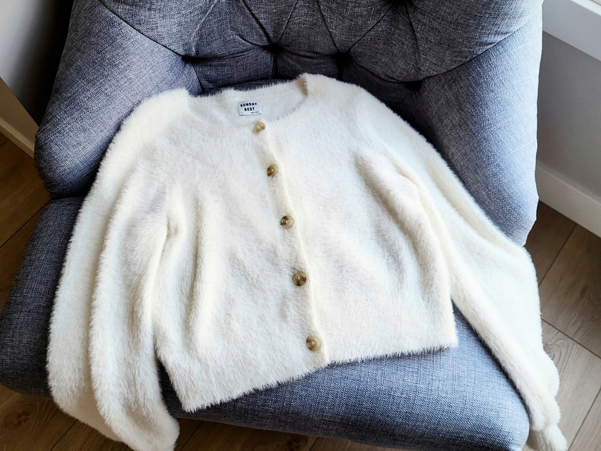 Fluffy Aritzia White Cardigan with Stylish Amber-like Buttons