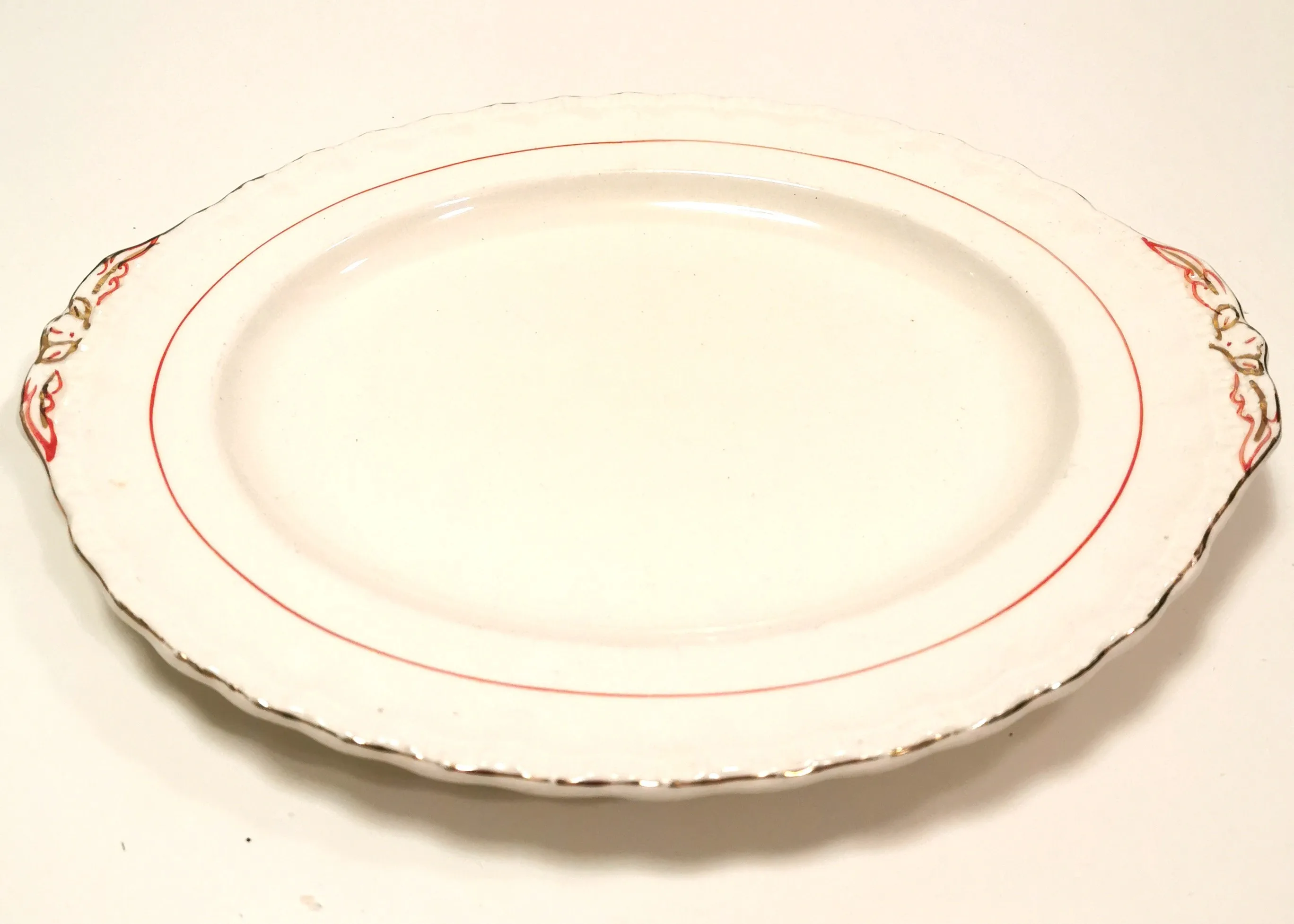 Cream oval platter with gold and red trim. Made in England by Gr thumbnail