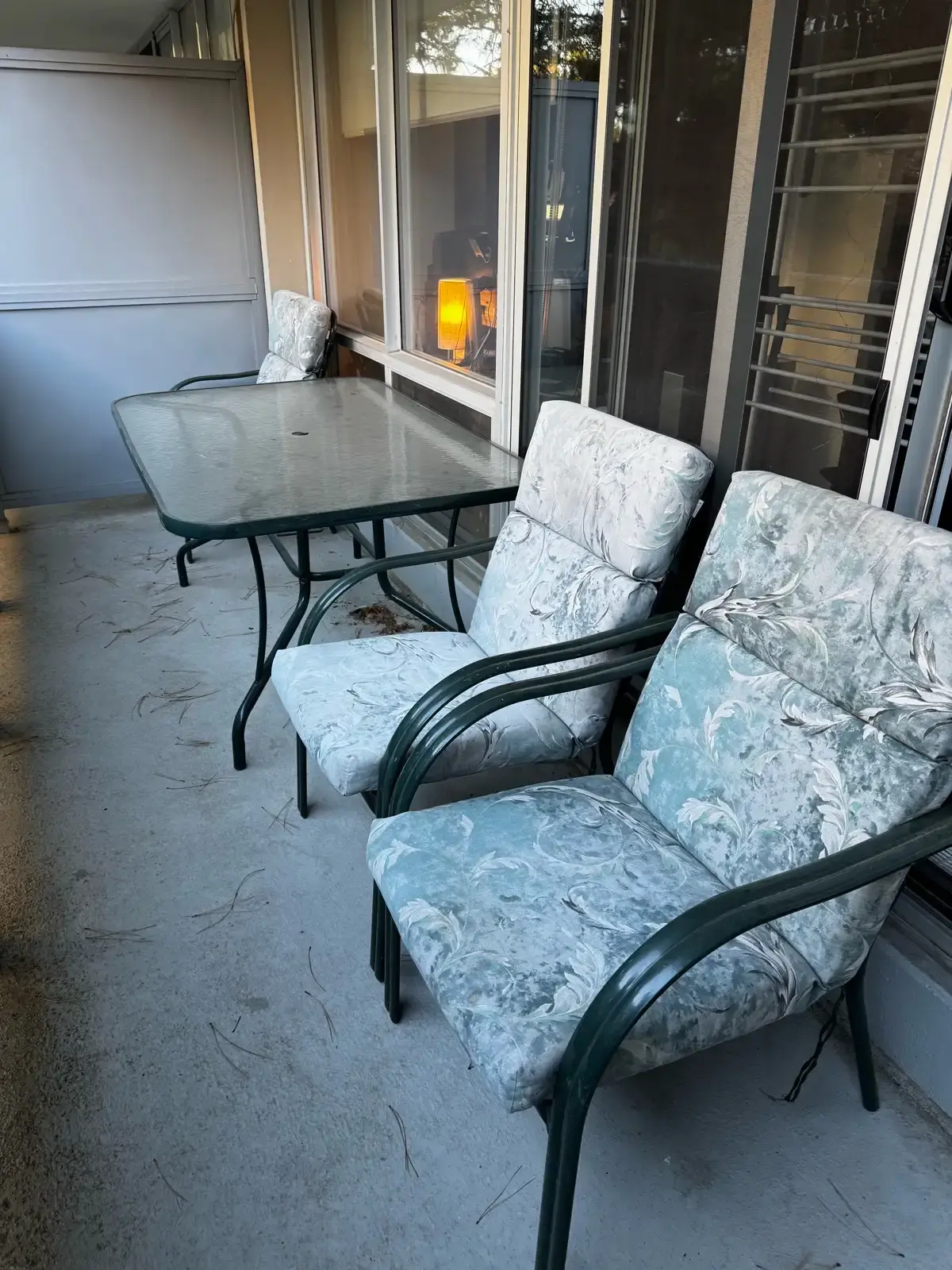 Glass Patio Table with 3 Cushioned Chairs – Great Condition