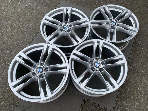 Set of Genuine factory F12 6 series 20" style 373 rims as New