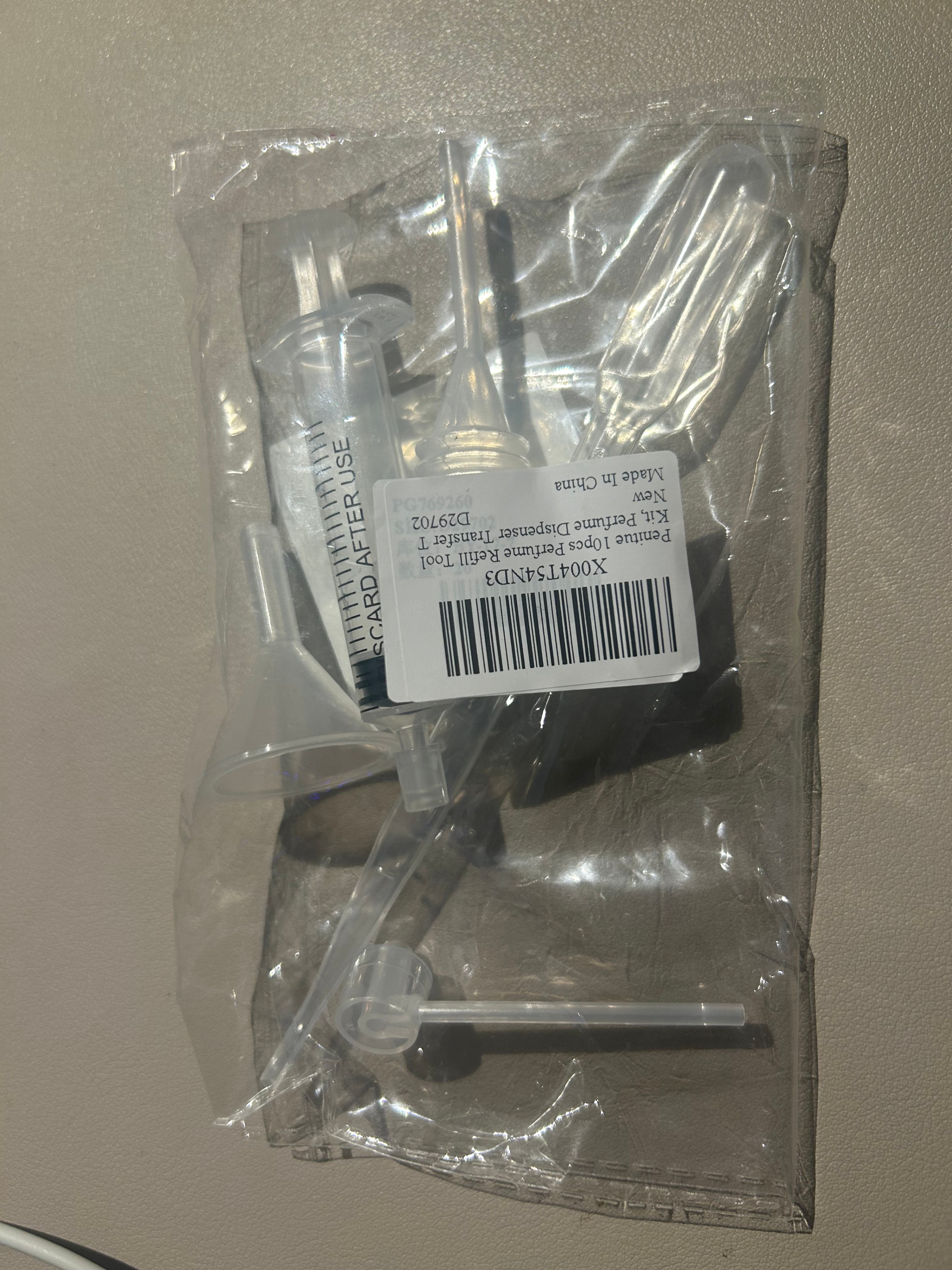 Tools for decanting perfume, brand new, $5.