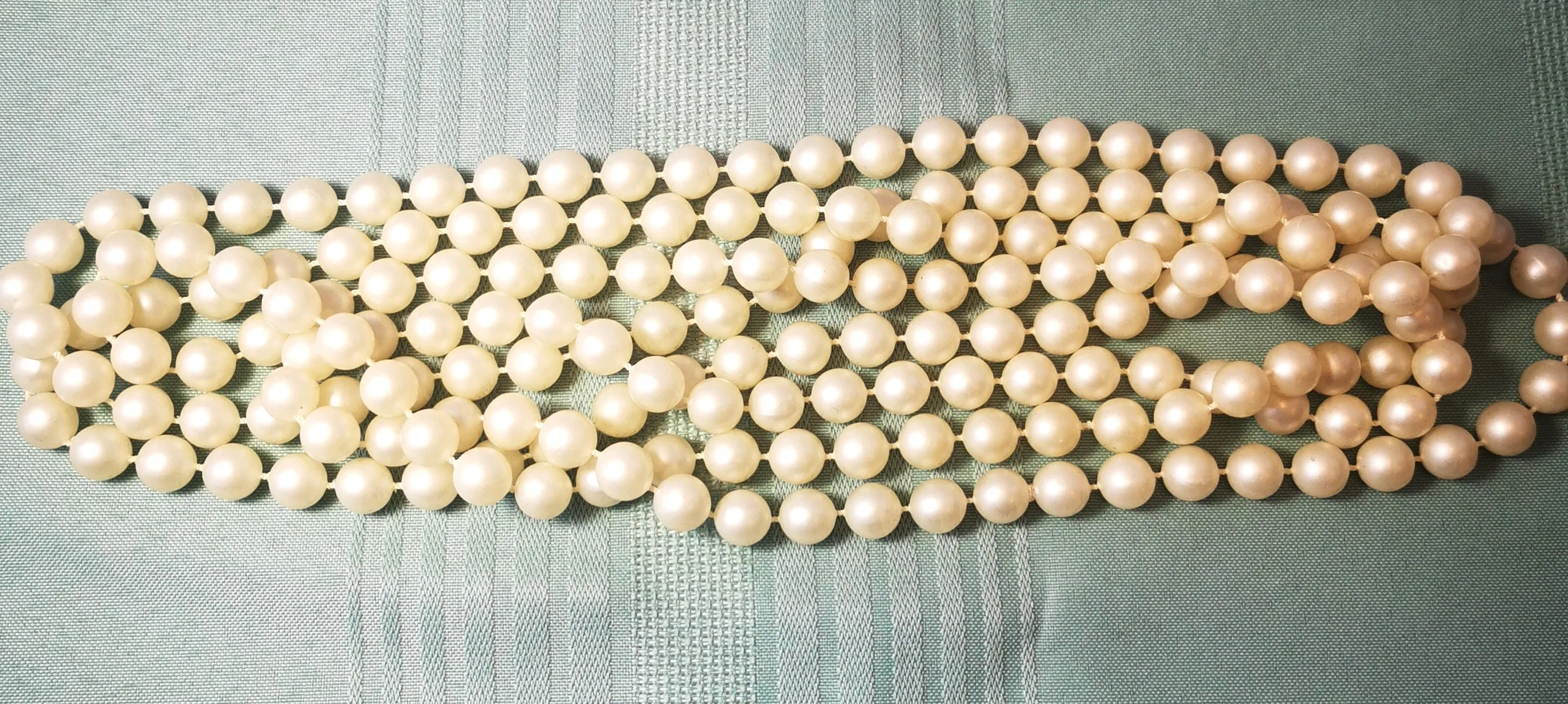 Multi-Strand White Bead Bracelet with Ornate Silver-Tone Clasp image indicator(4)