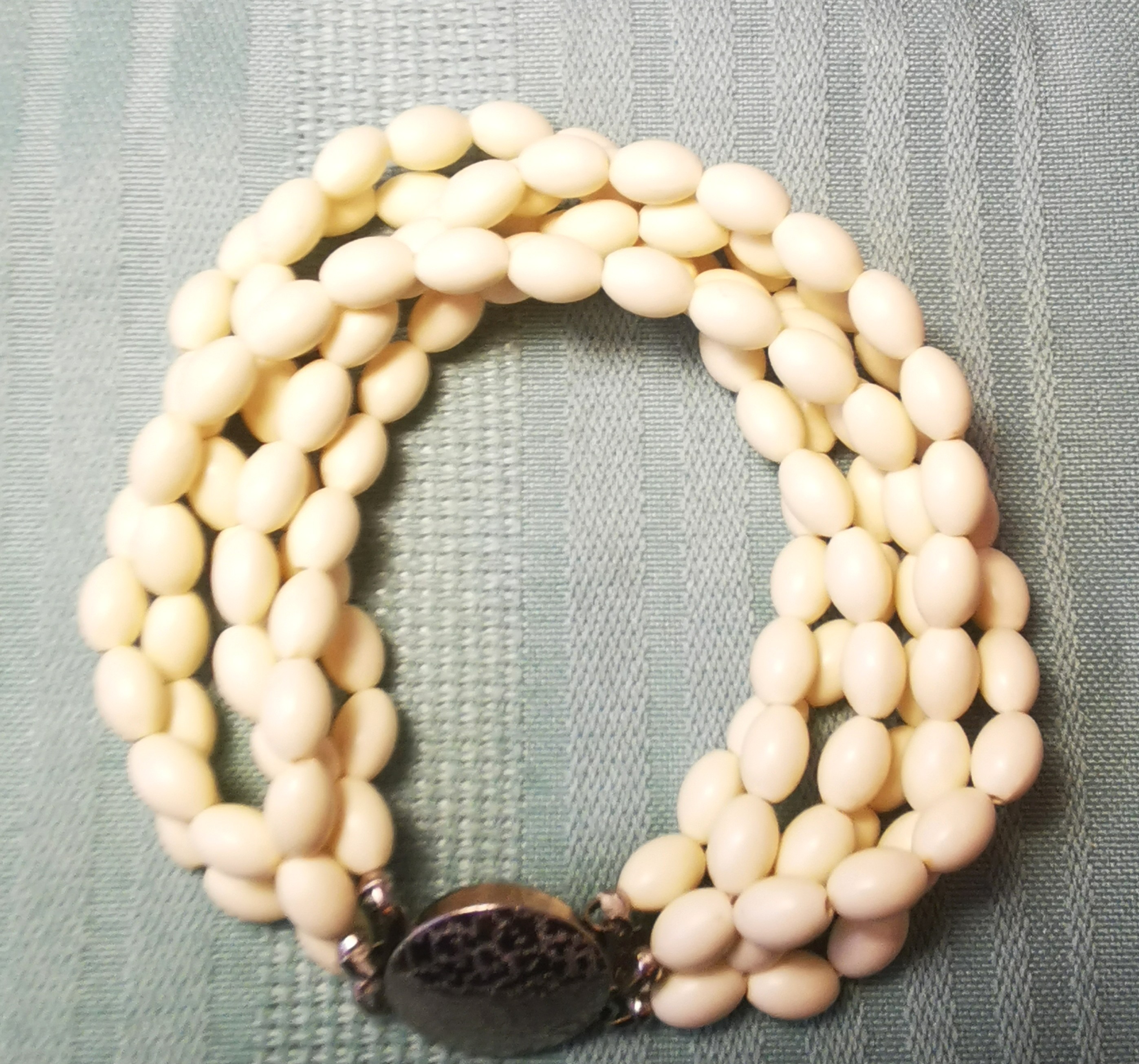 Multi-Strand White Bead Bracelet with Ornate Silver-Tone Clasp