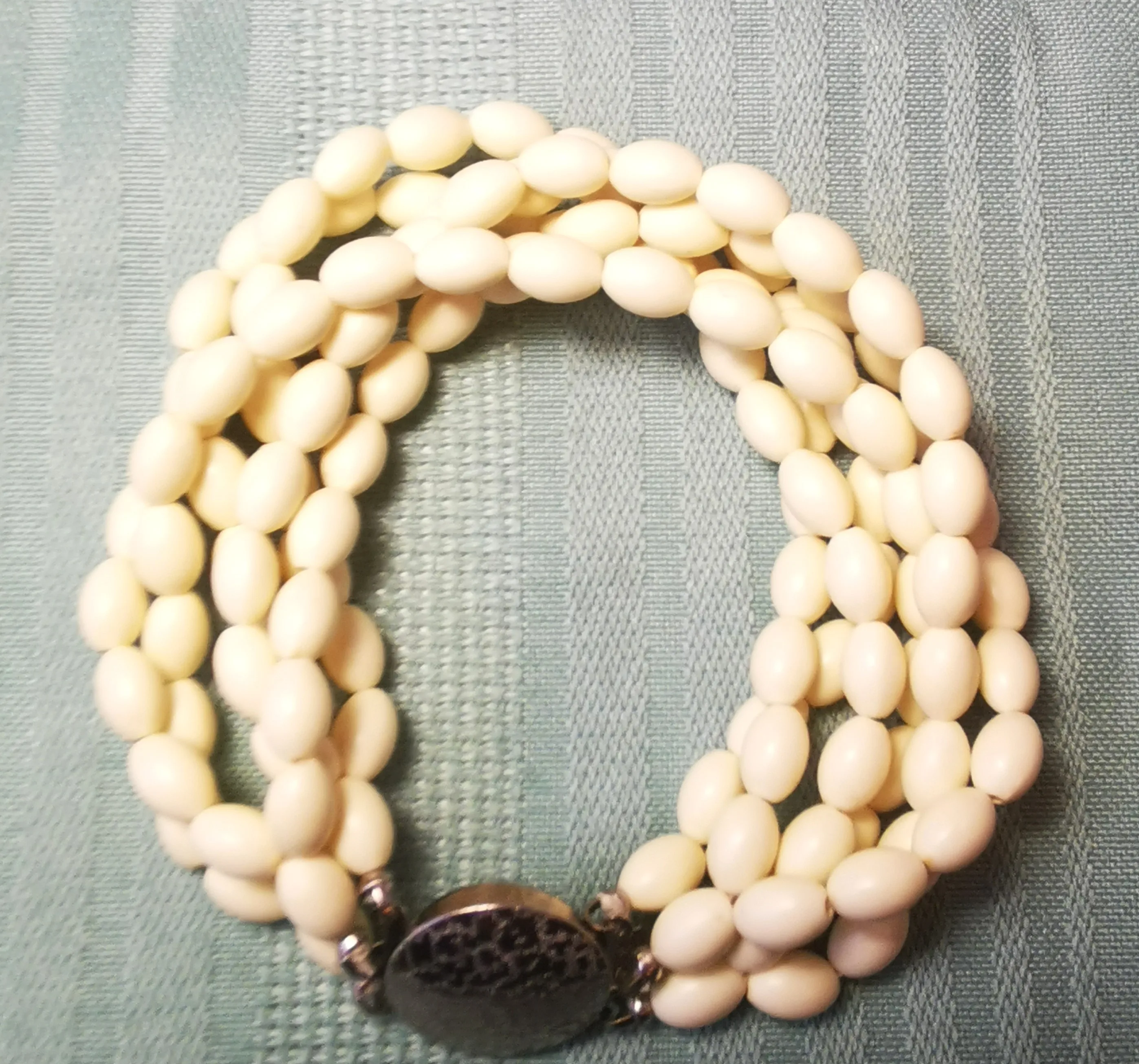 Multi-Strand White Bead Bracelet with Ornate Silver-Tone Clasp