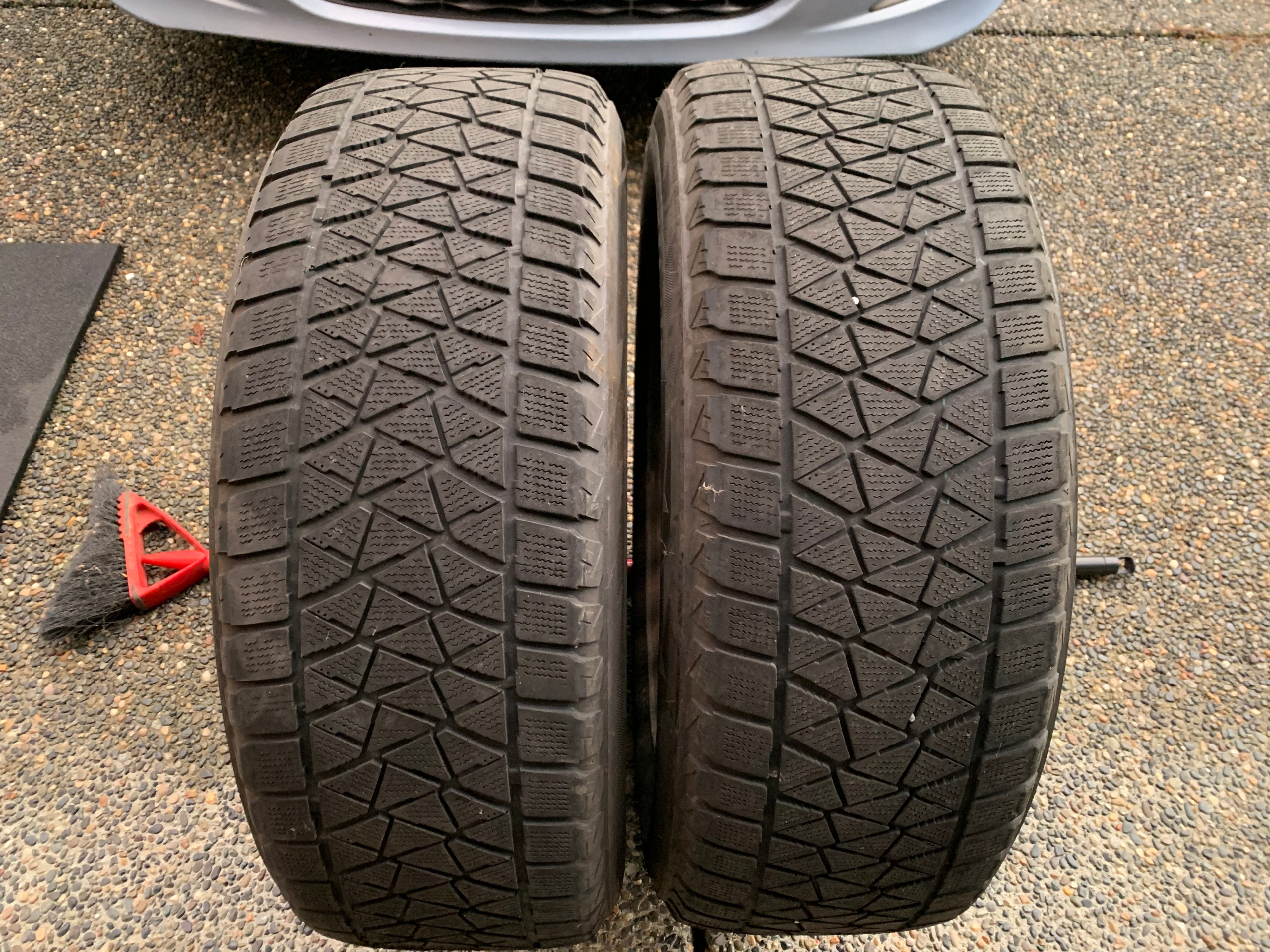 PAIR of Black steel rims mounted with bridgestone Blizzak DMV2