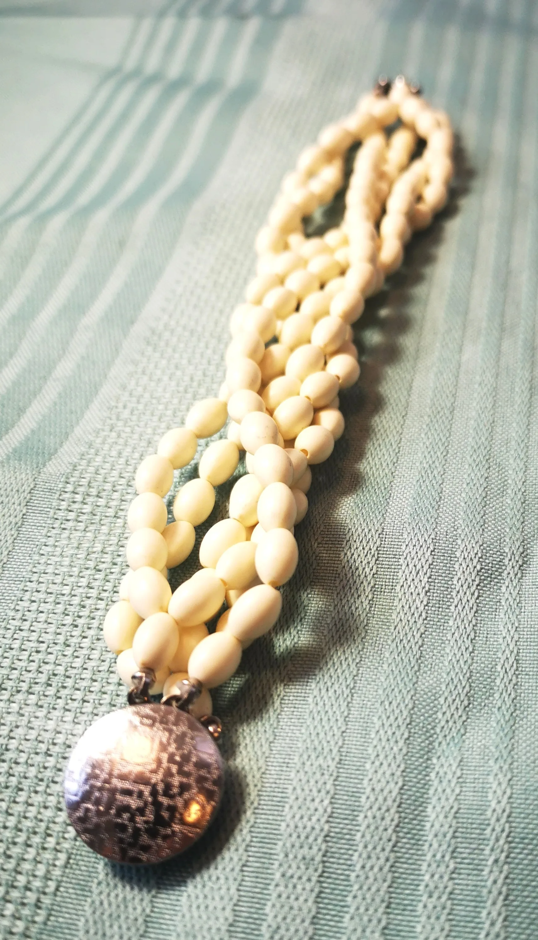 Multi-Strand White Bead Bracelet with Ornate Silver-Tone Clasp image indicator(2)