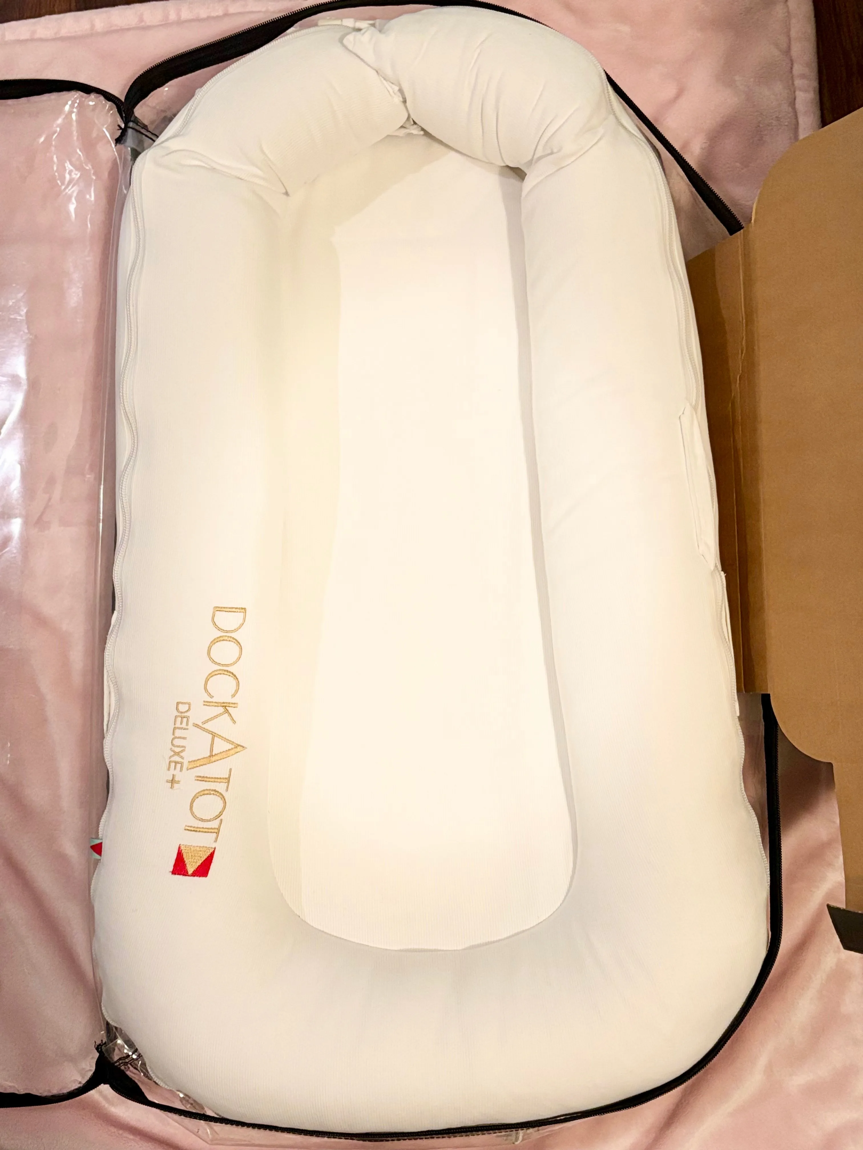 White Deluxe+ DockATot w Pink Cover  — GREAT condition