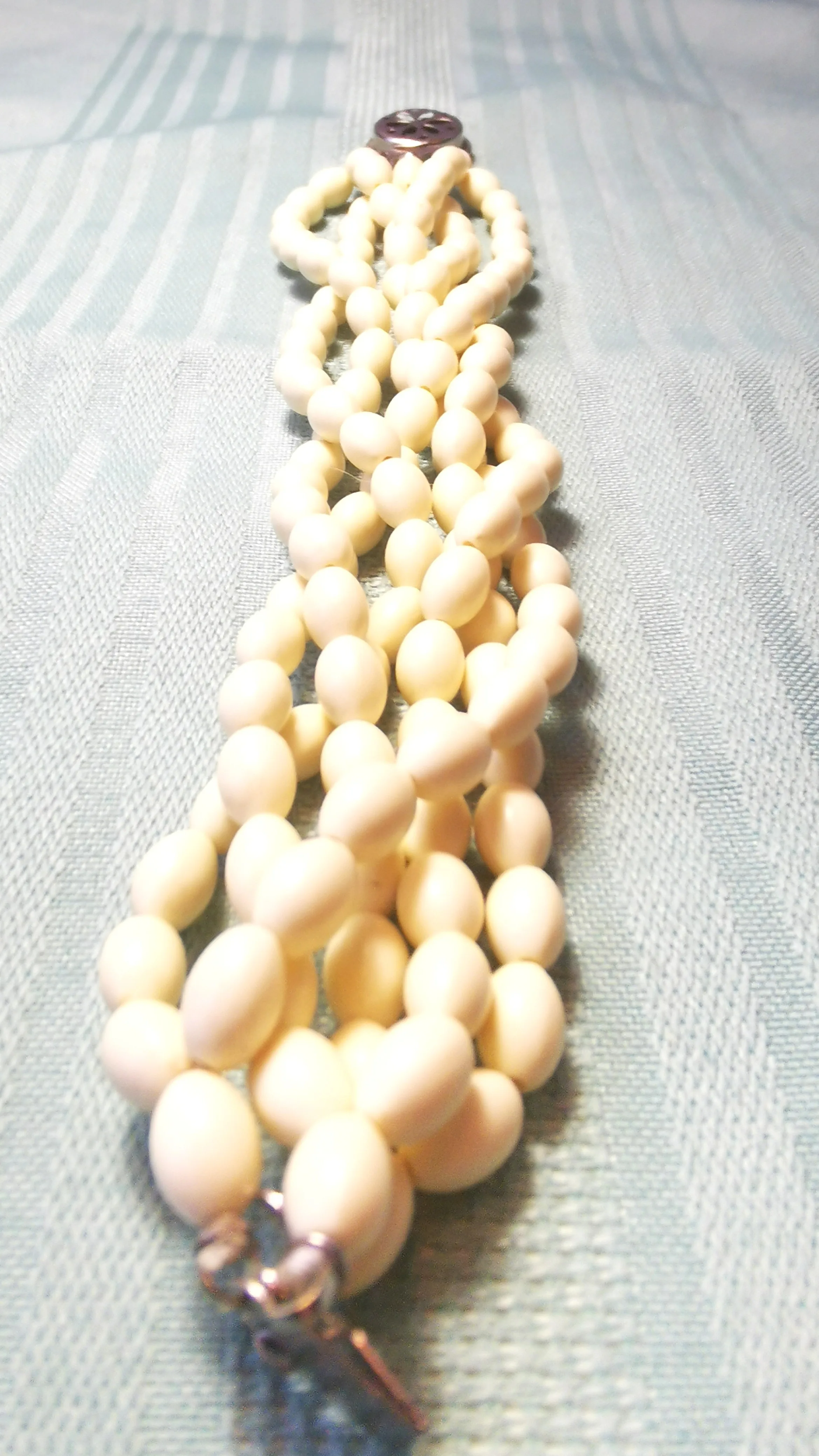 Multi-Strand White Bead Bracelet with Ornate Silver-Tone Clasp image indicator(9)