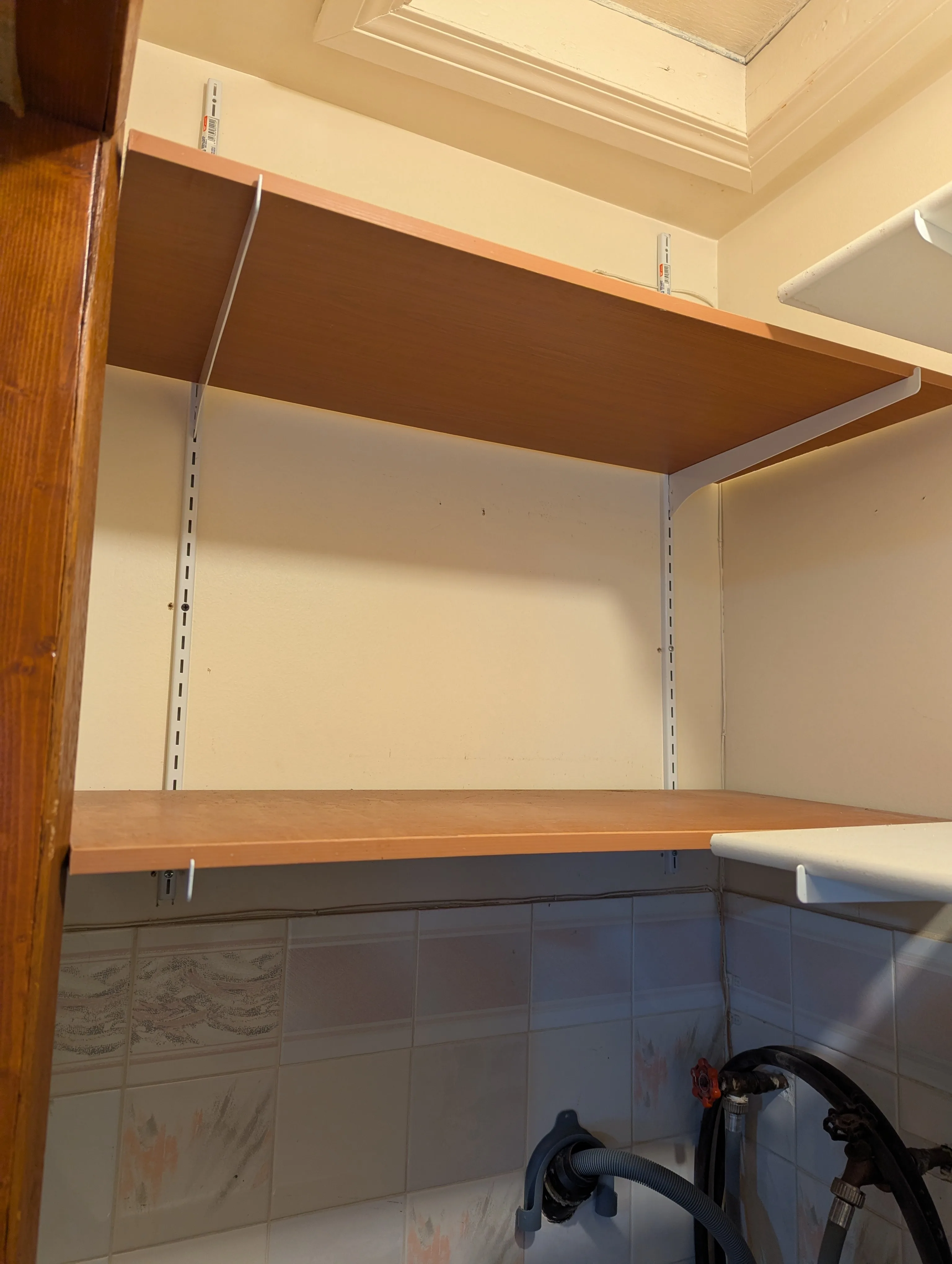 4 wood shelves and metal support brackets for utility or garage