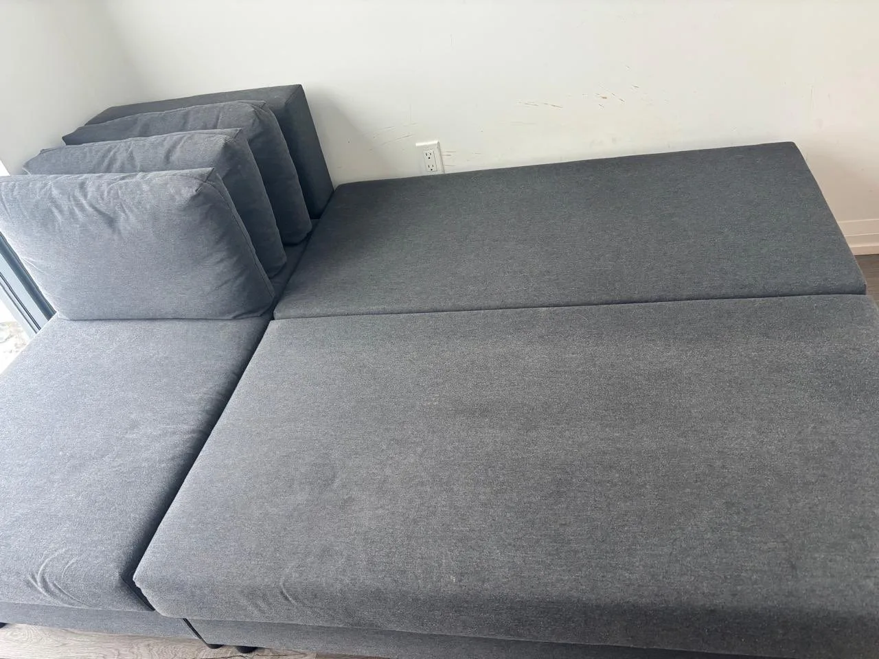 Corner sofa-bed with storage, dark gray