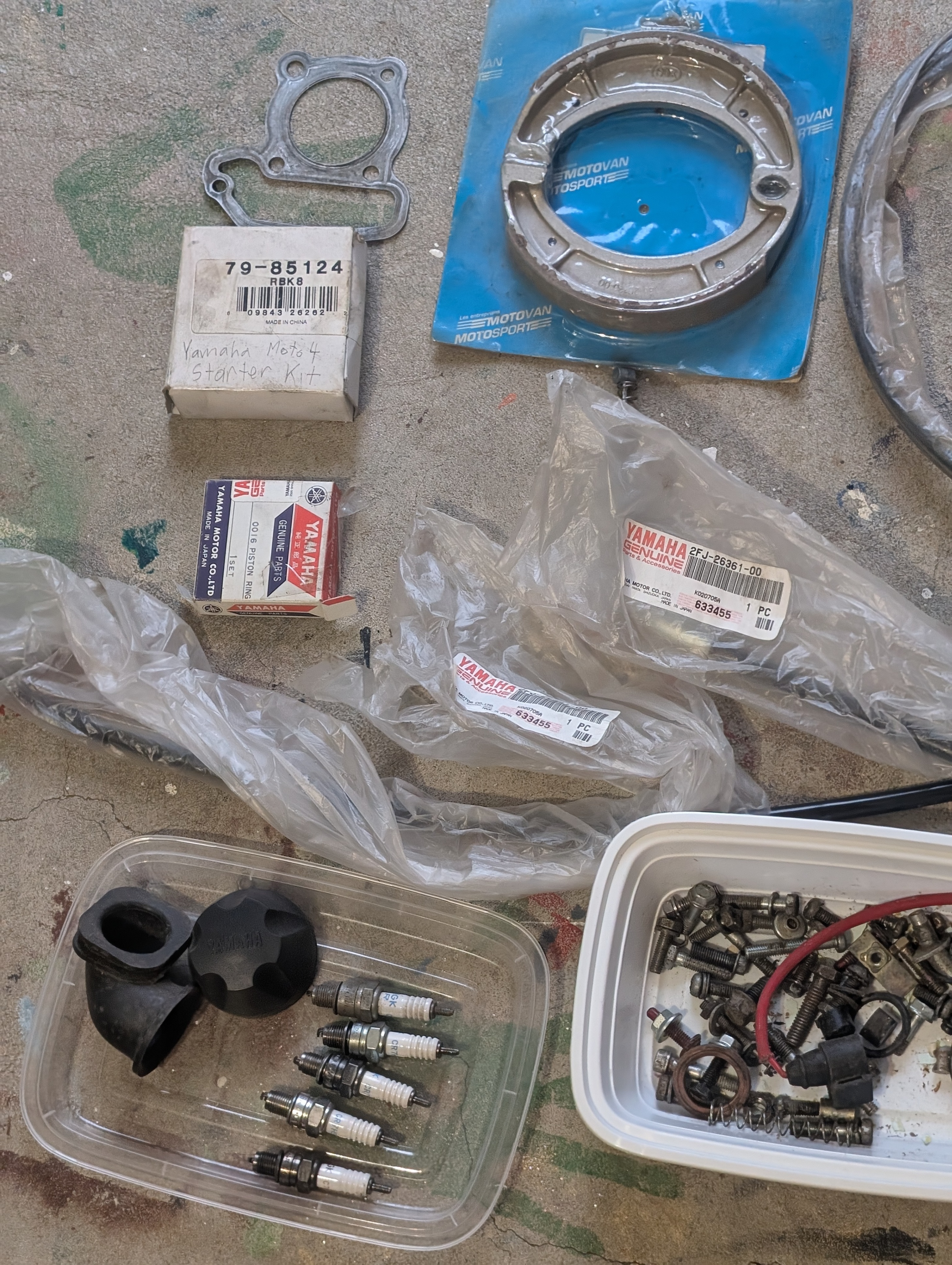 Yamaha Moto 4 parts, a mix of new and used