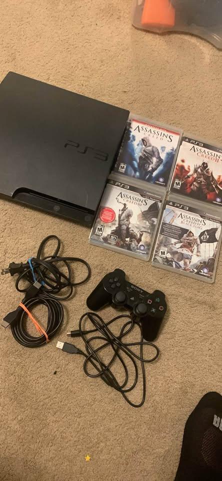Sony PS3 Console with 4 Games