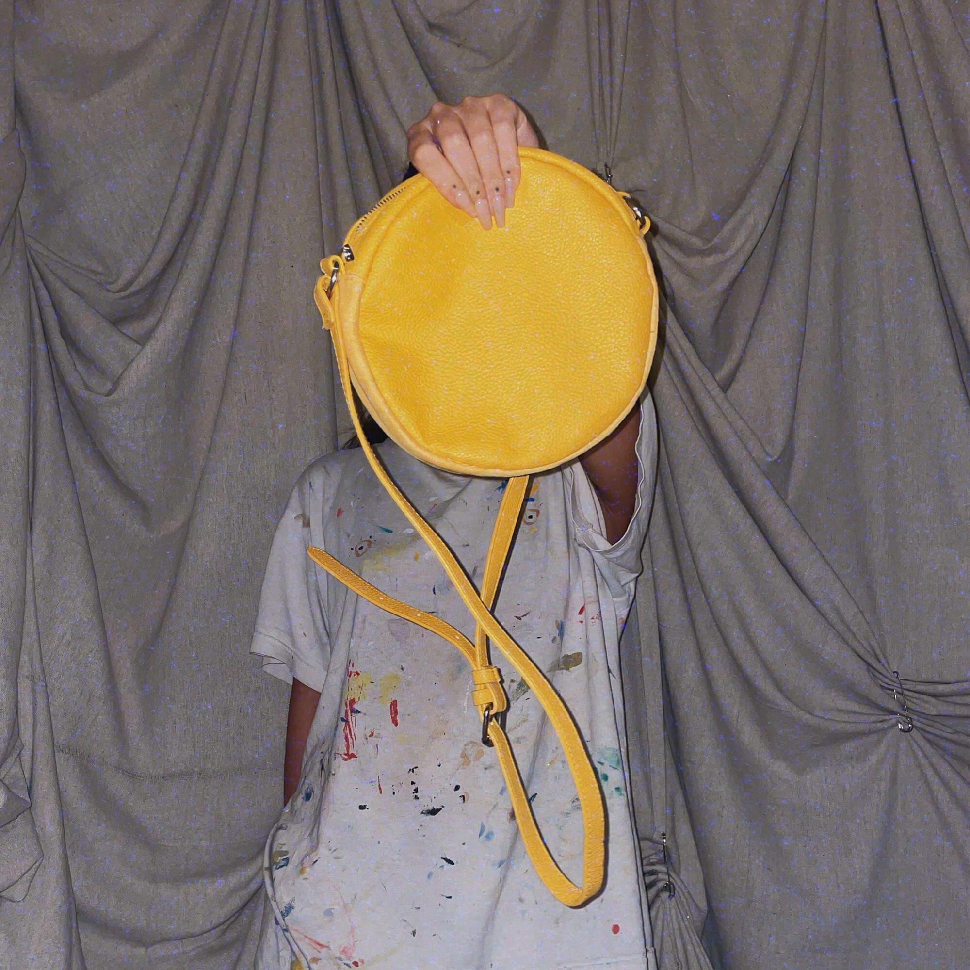 small yellow circle crossover purse bag
