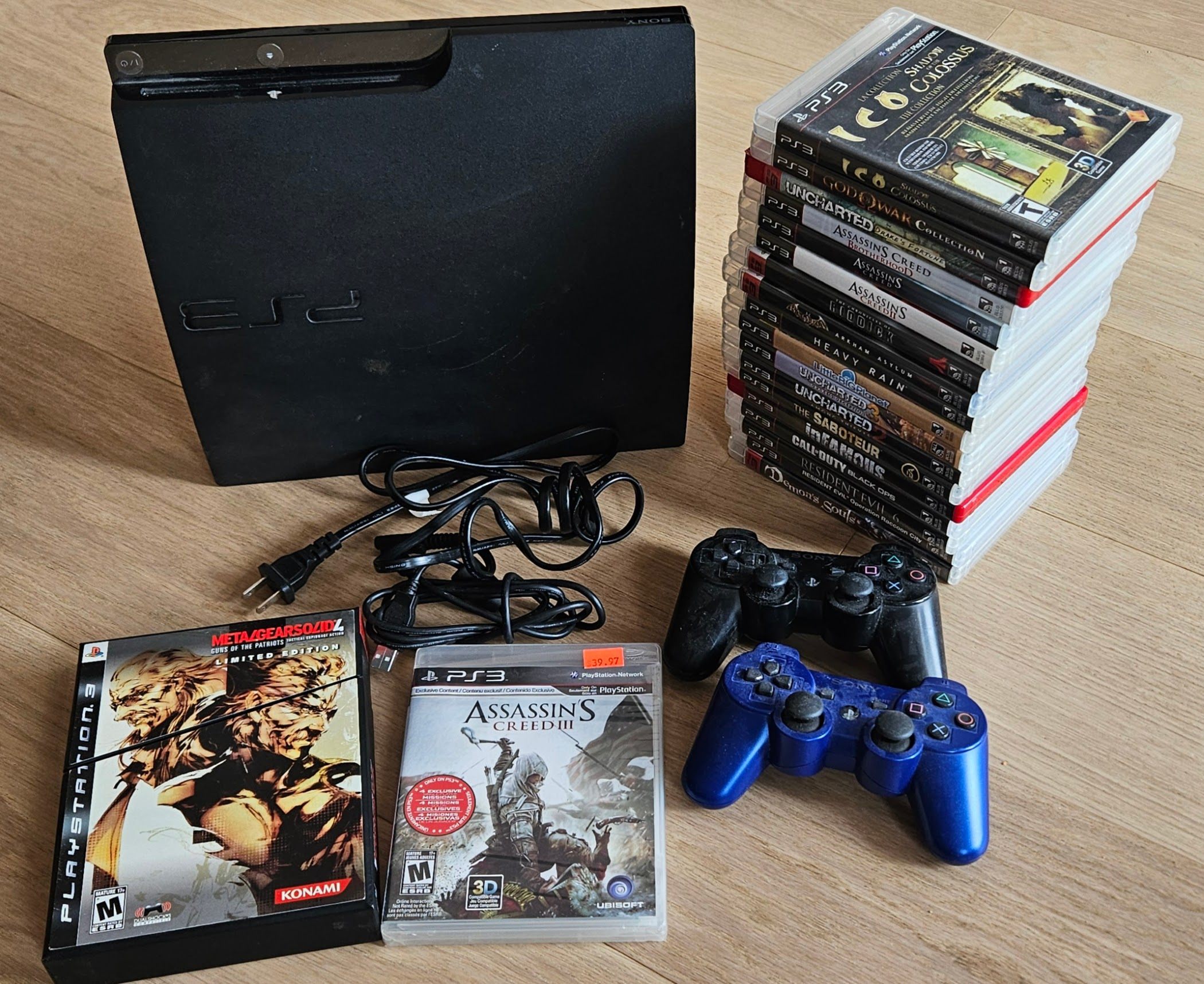 PS3 + Controllers, Metal Gear Solid4 set , ACreed, plus 18