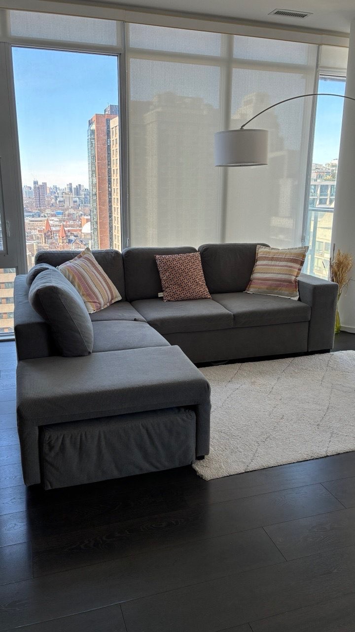 Comfy Grey Sofa Bed with Chaise – Great for Condos