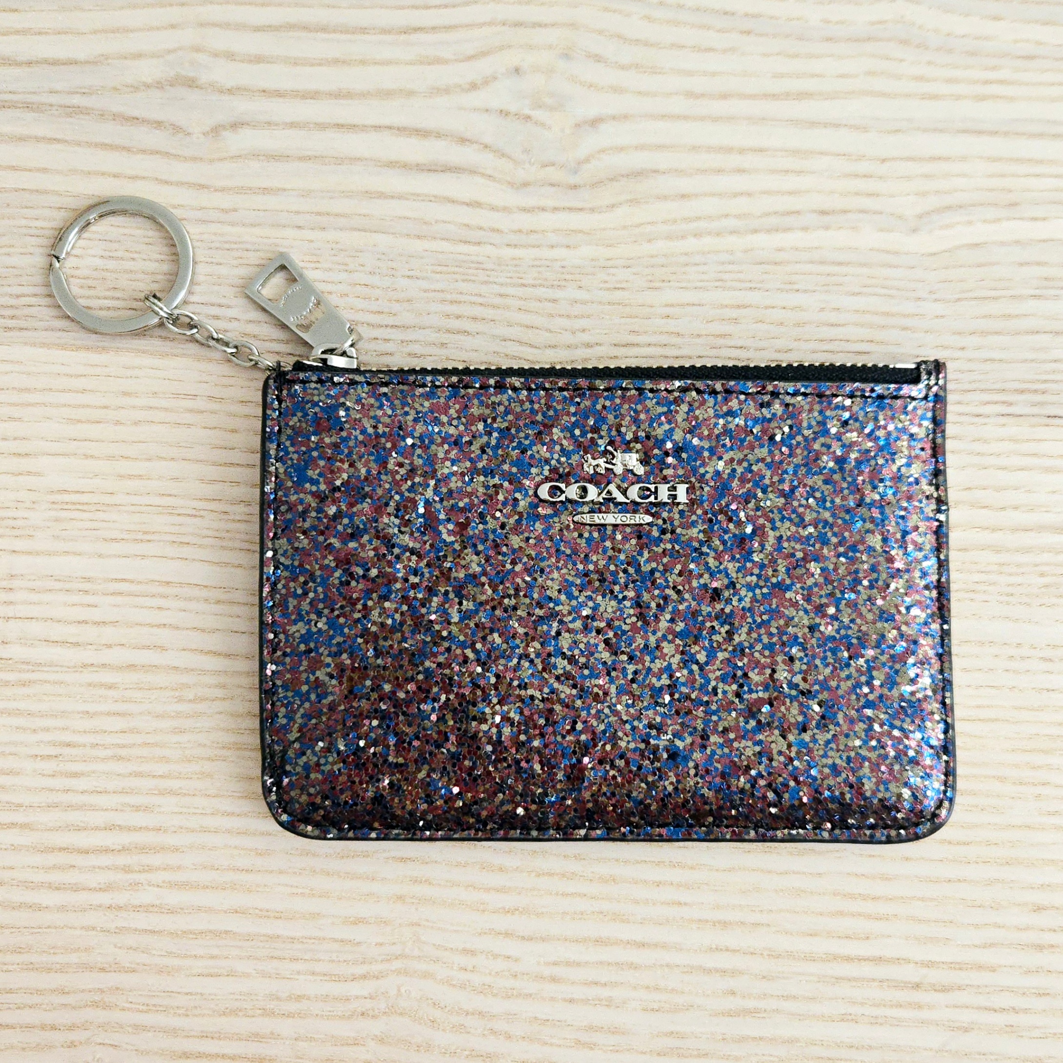 COACH's Glitter zip card case