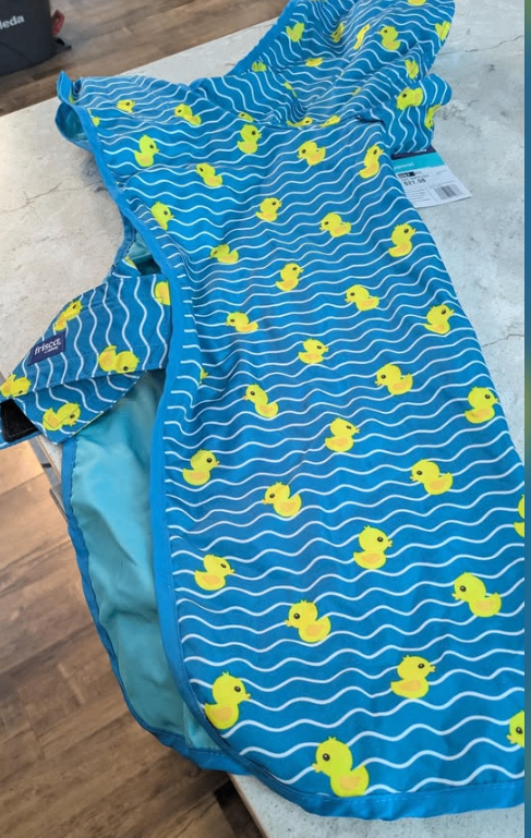 Brand new rain coat with rubber ducks