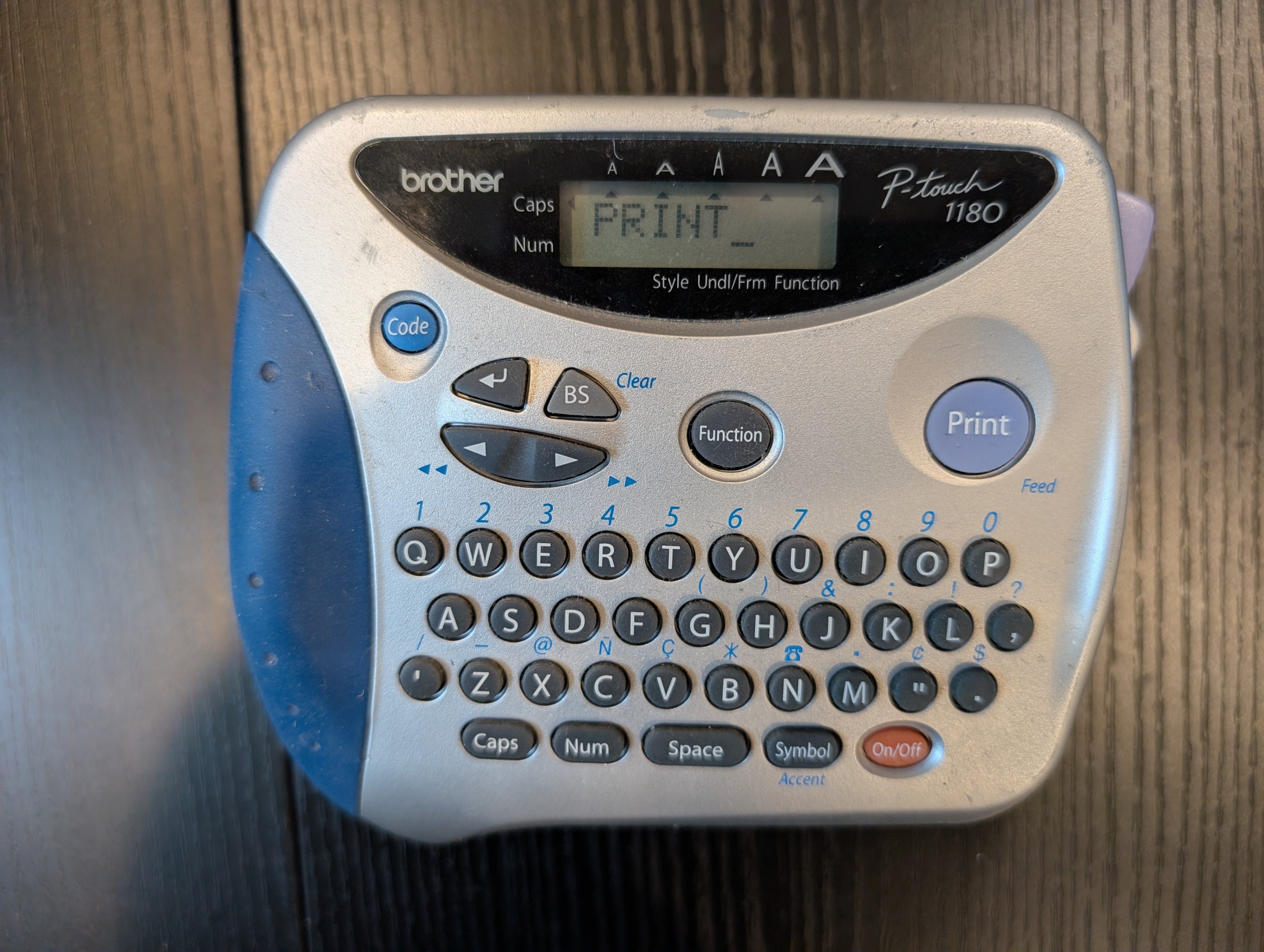 Brother P-touch 1180 label maker w/tape