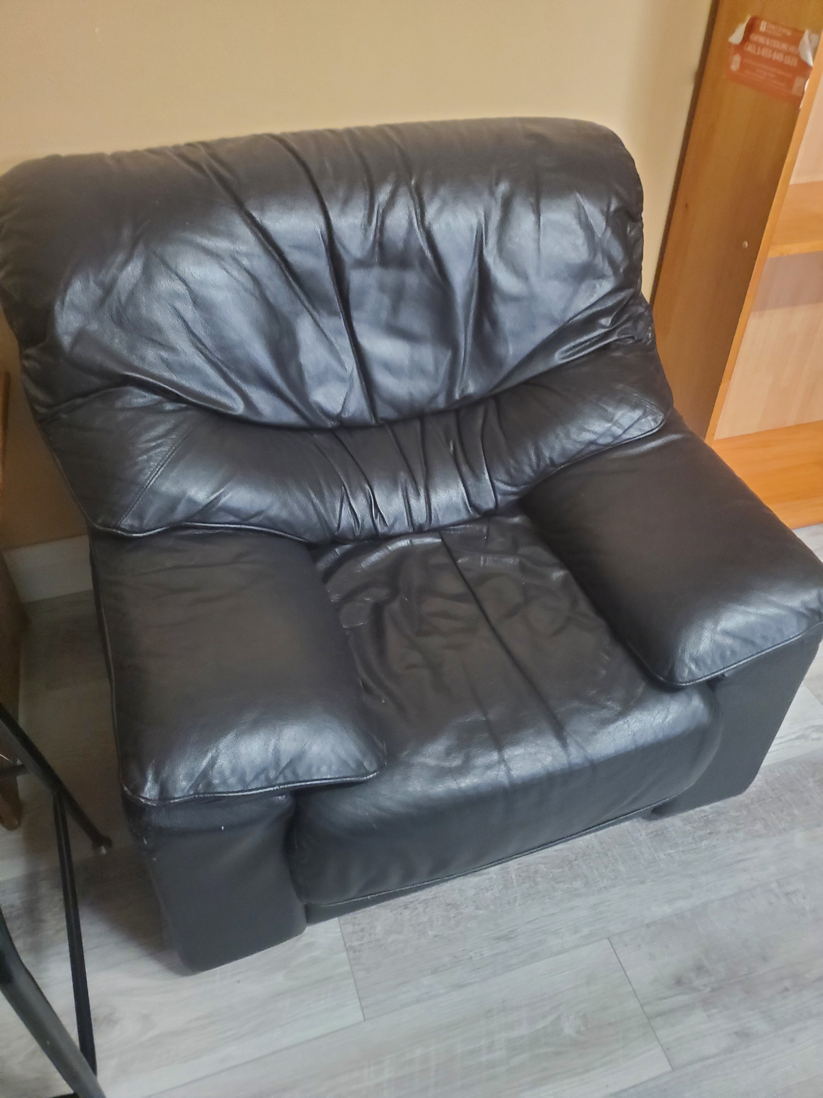 Black leather one seater