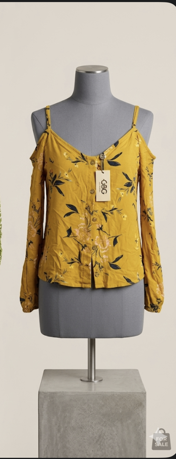 Blusa femenina color mostaza con estampado floral
