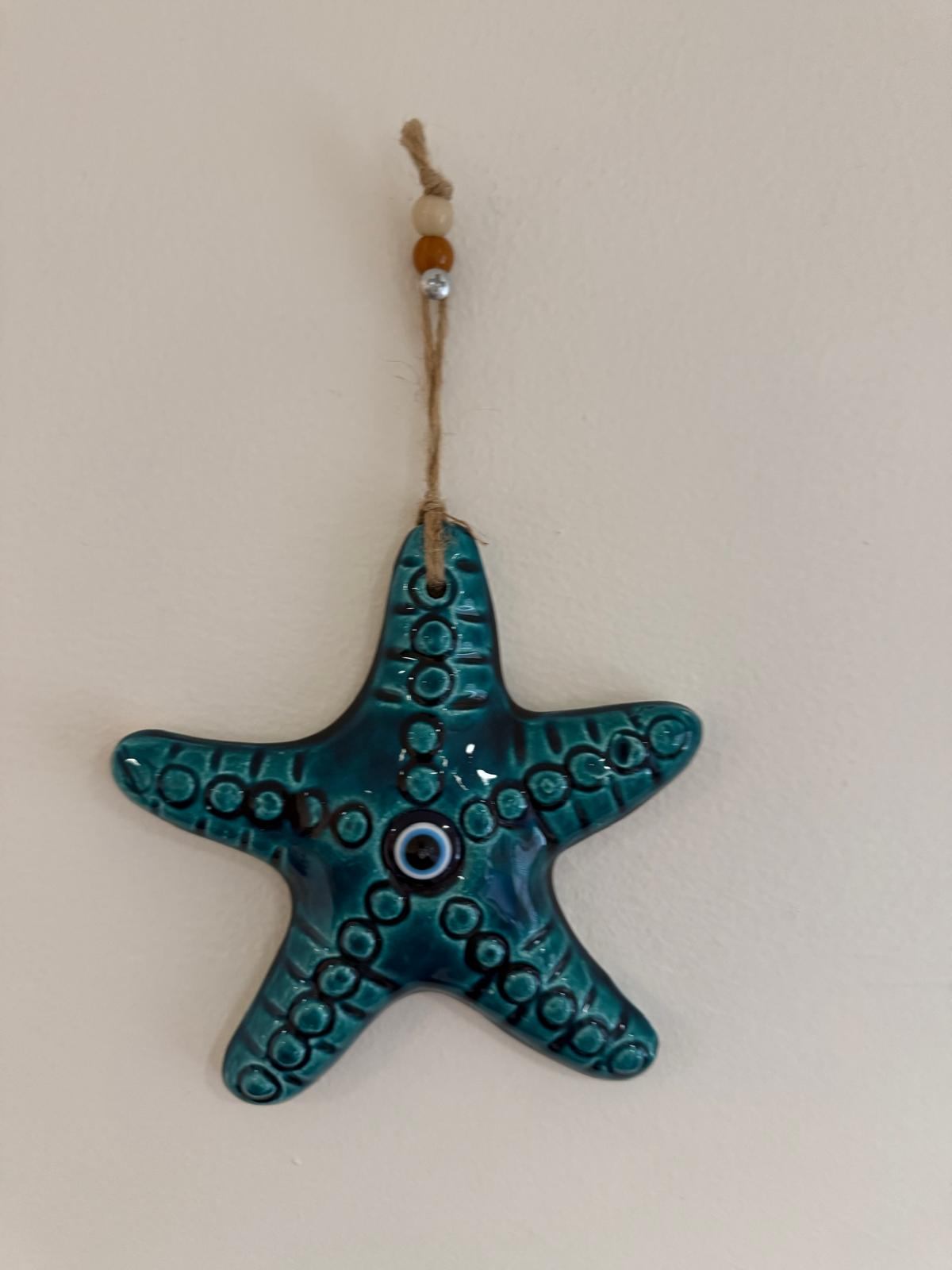 Sea star (starfish) and evil eye - photo 2