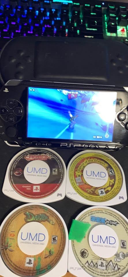 Sony PSP Console with 4  Games charger and case!