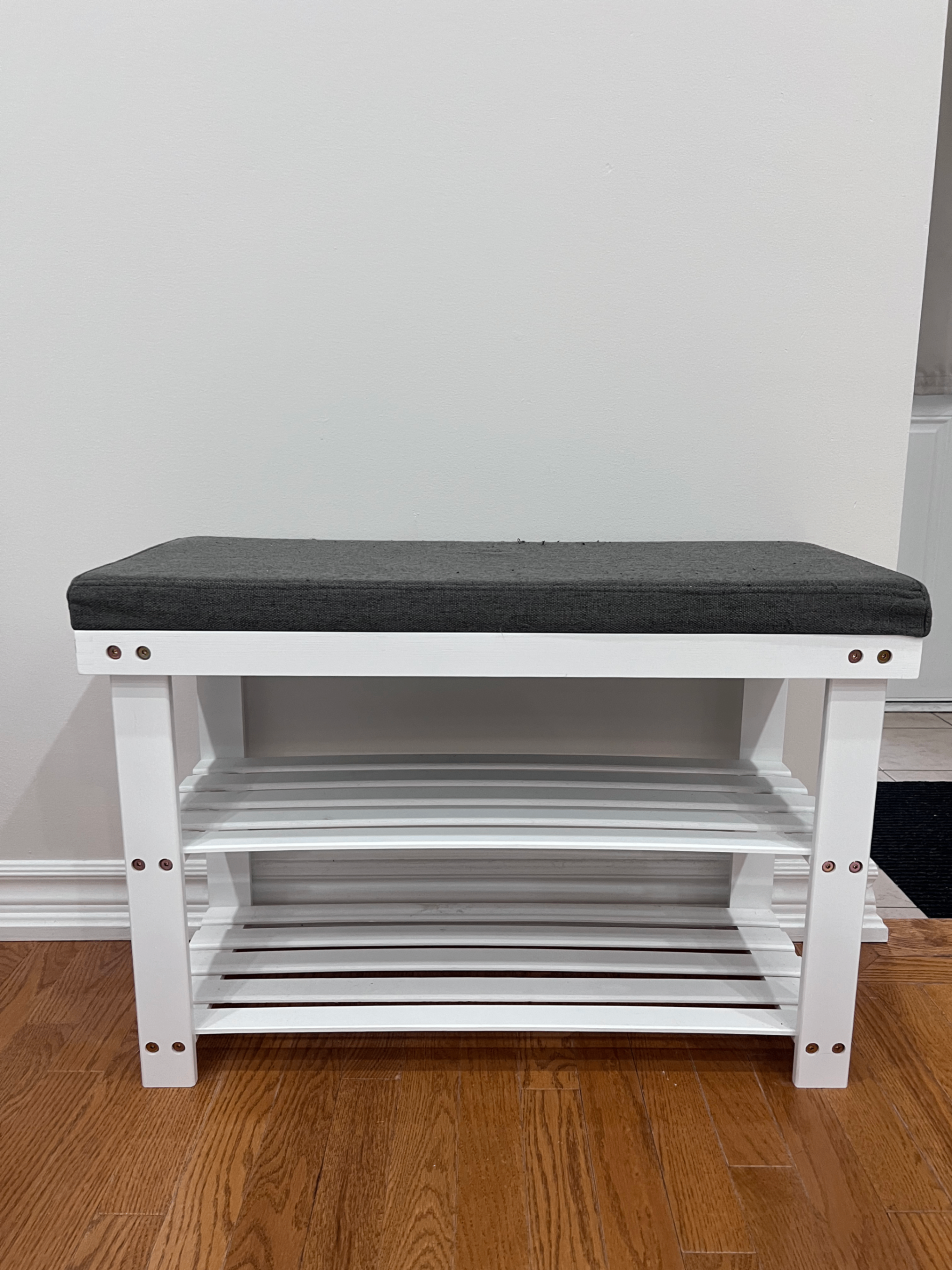 Bench with padded seat and shoe storage