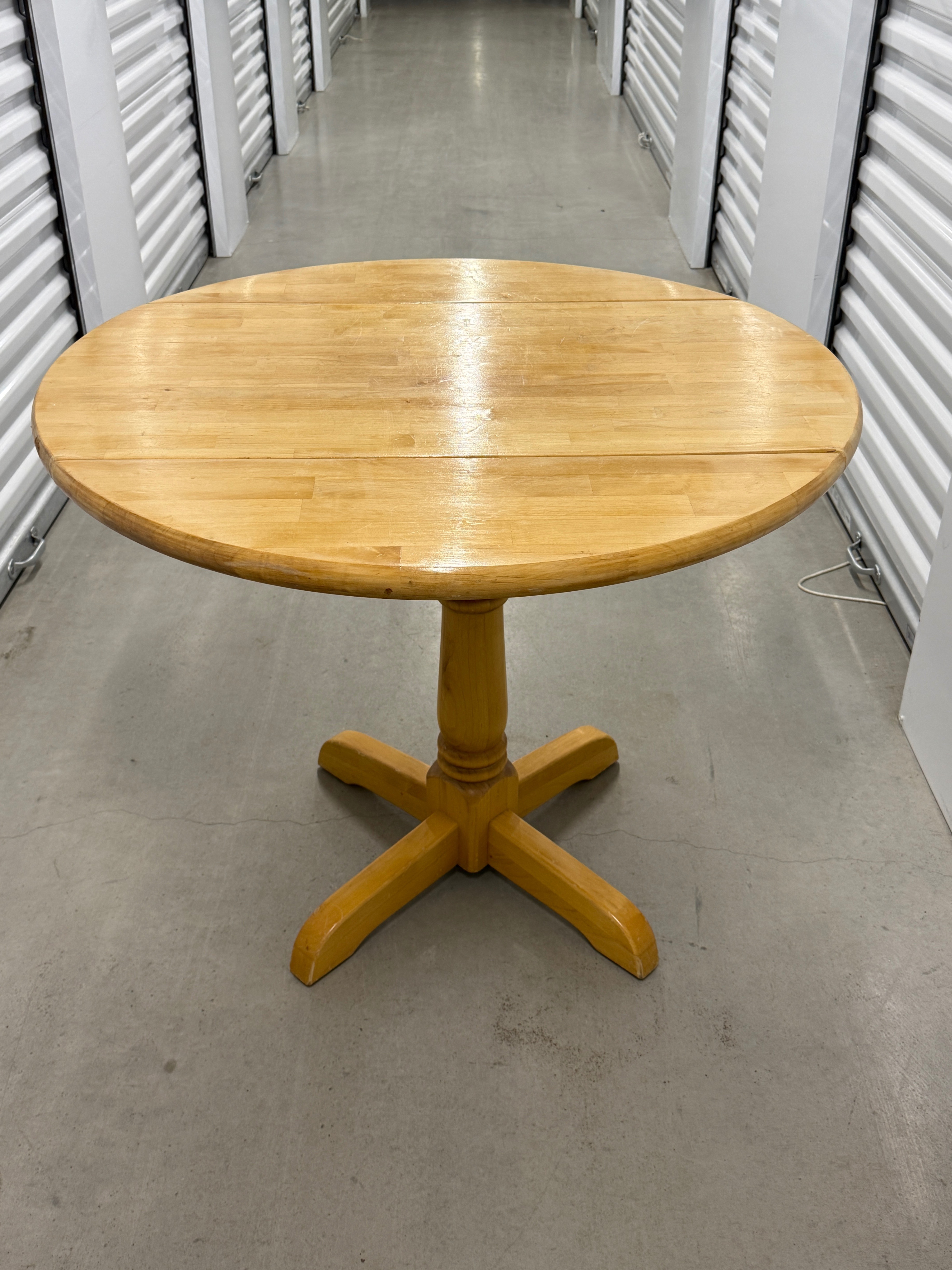 Wood drop leaf pedestal table