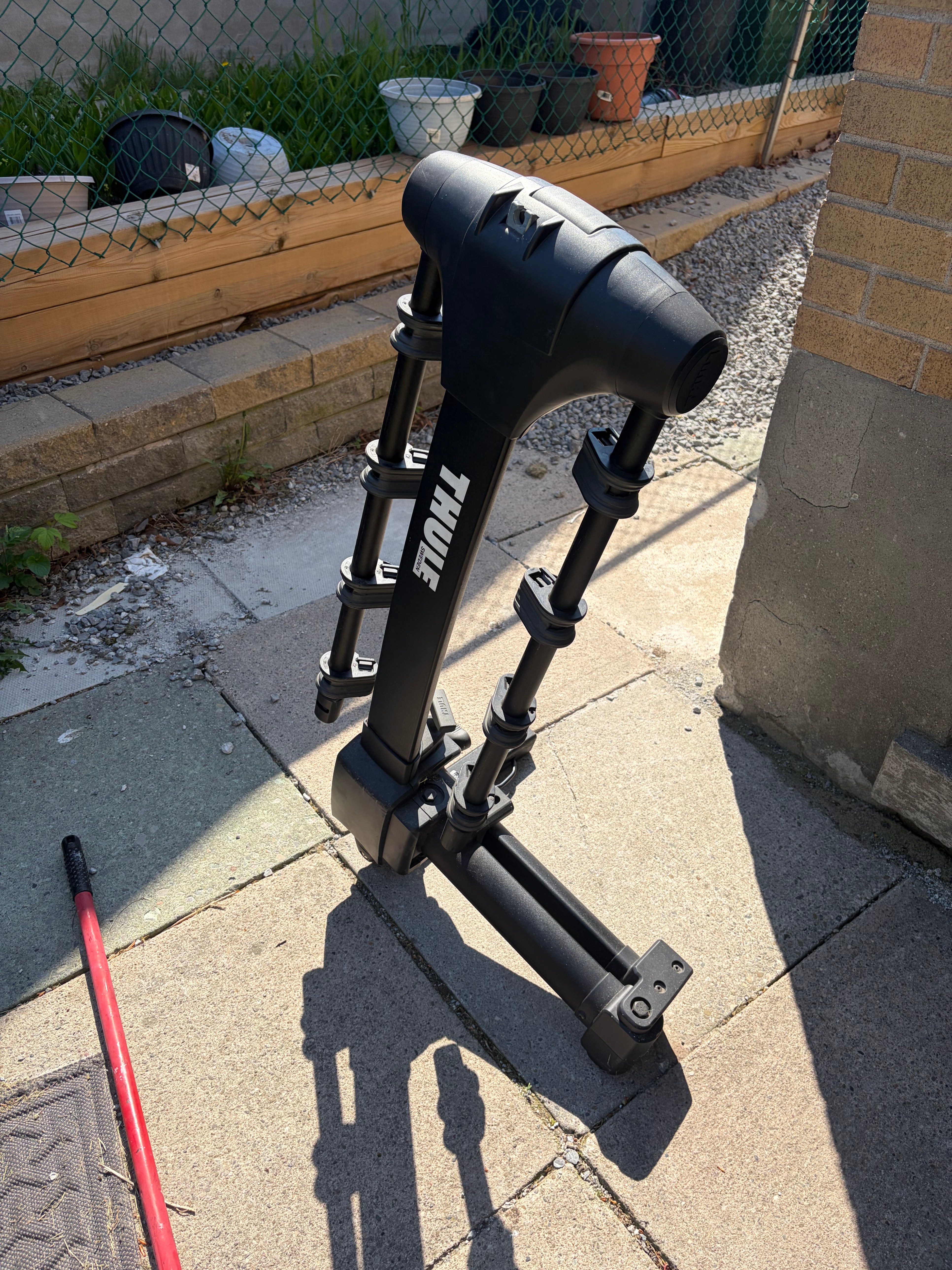 Thule Apex XT Swing 4-Bike Hitch Rack - Open trunk with bikes