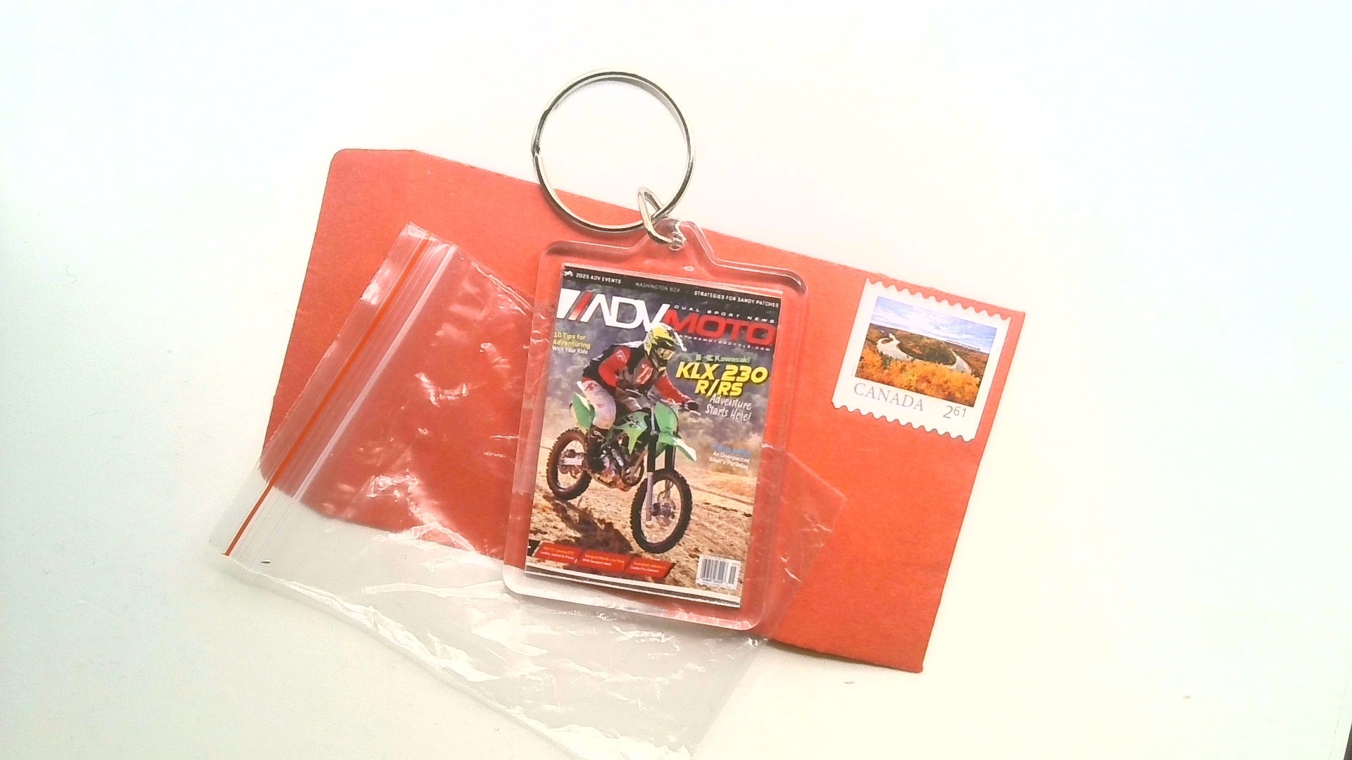 INDY MOTO ( MAGAZINE KEY CHAIN ) FREE SHIPPING