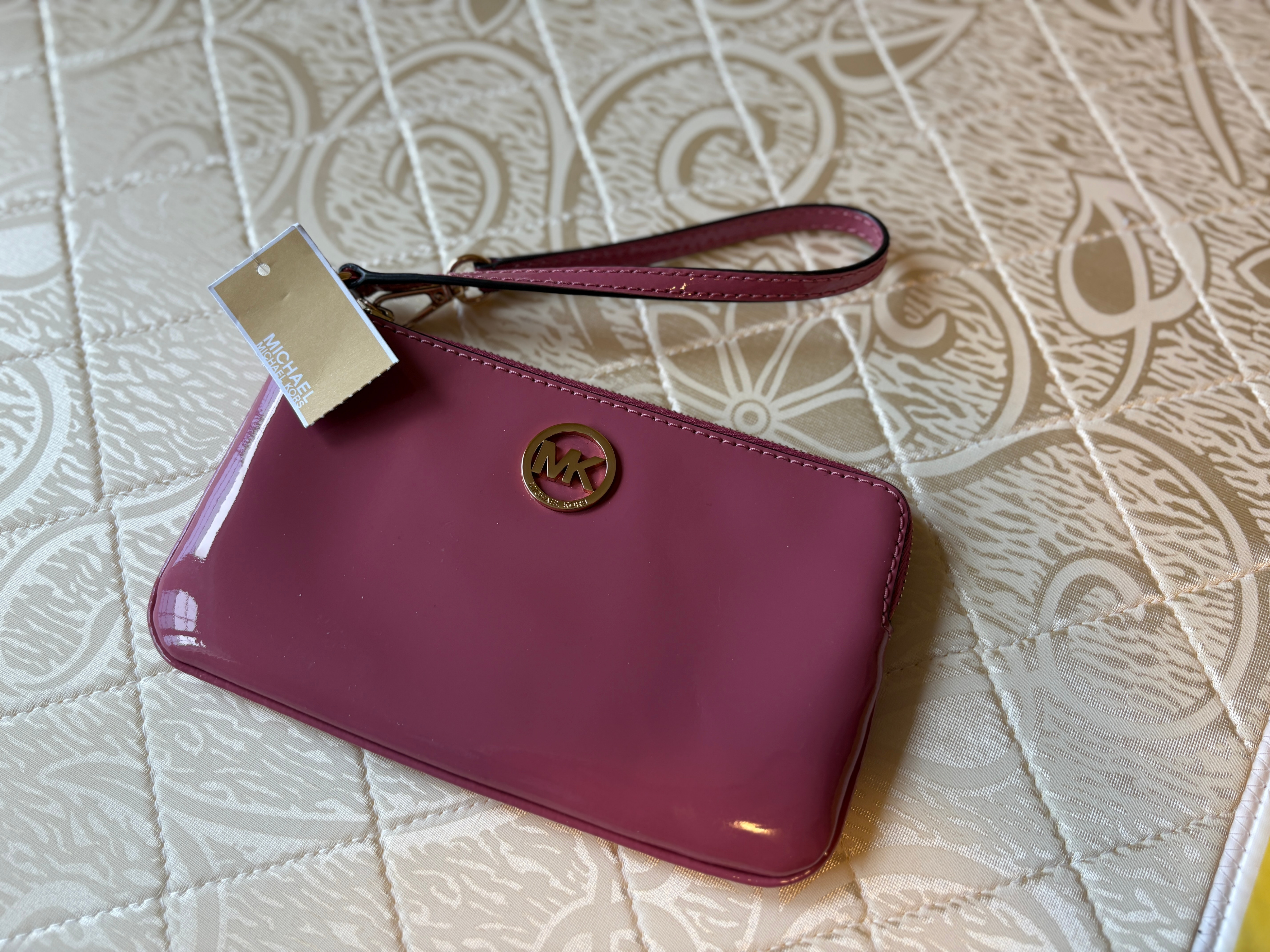 Michael Kors pink patent leather wristlet